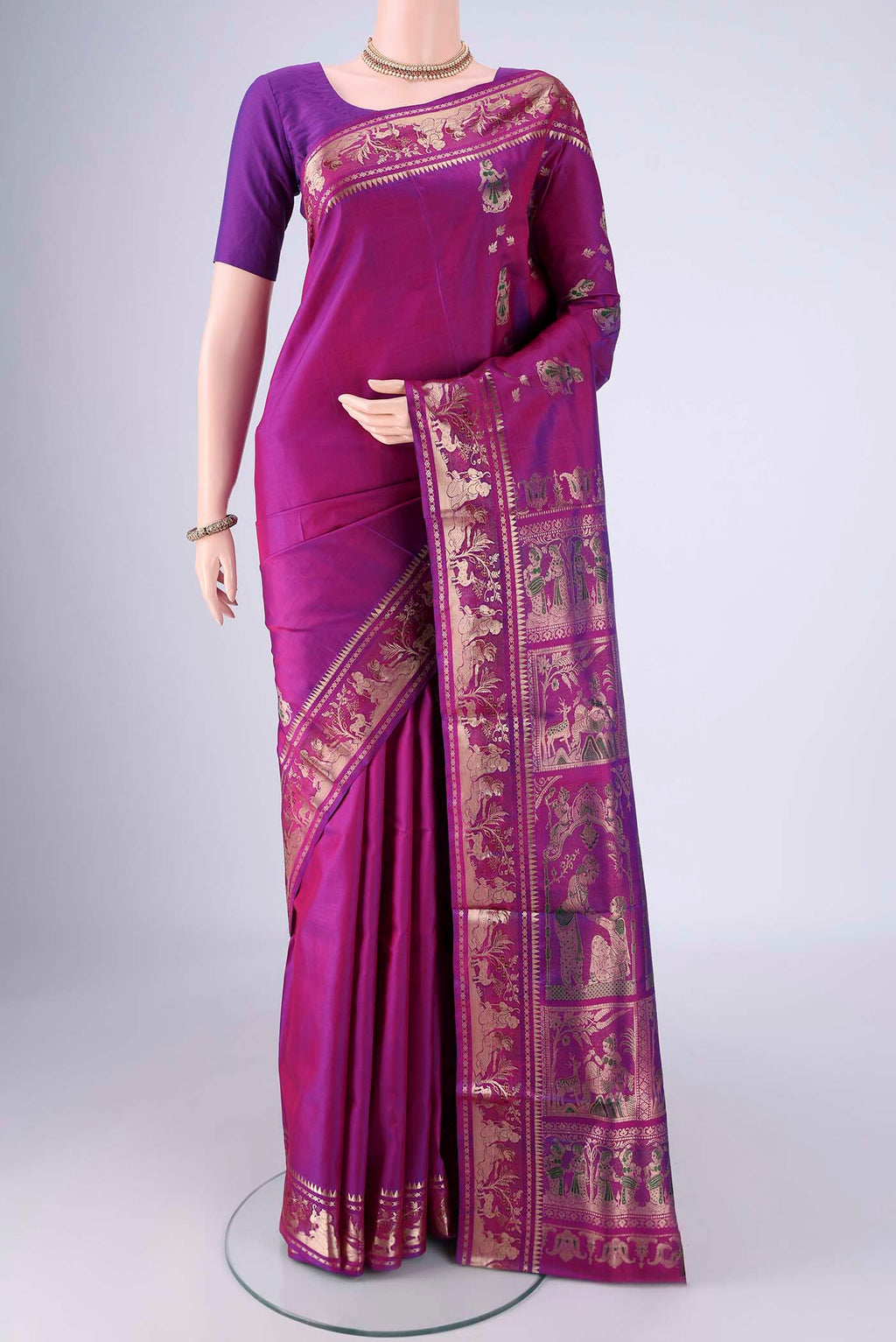 Purple Baluchari Silk Saree with Zari And Thread Butta on the body and Zari And Thread Border.  displayed on a mannequin