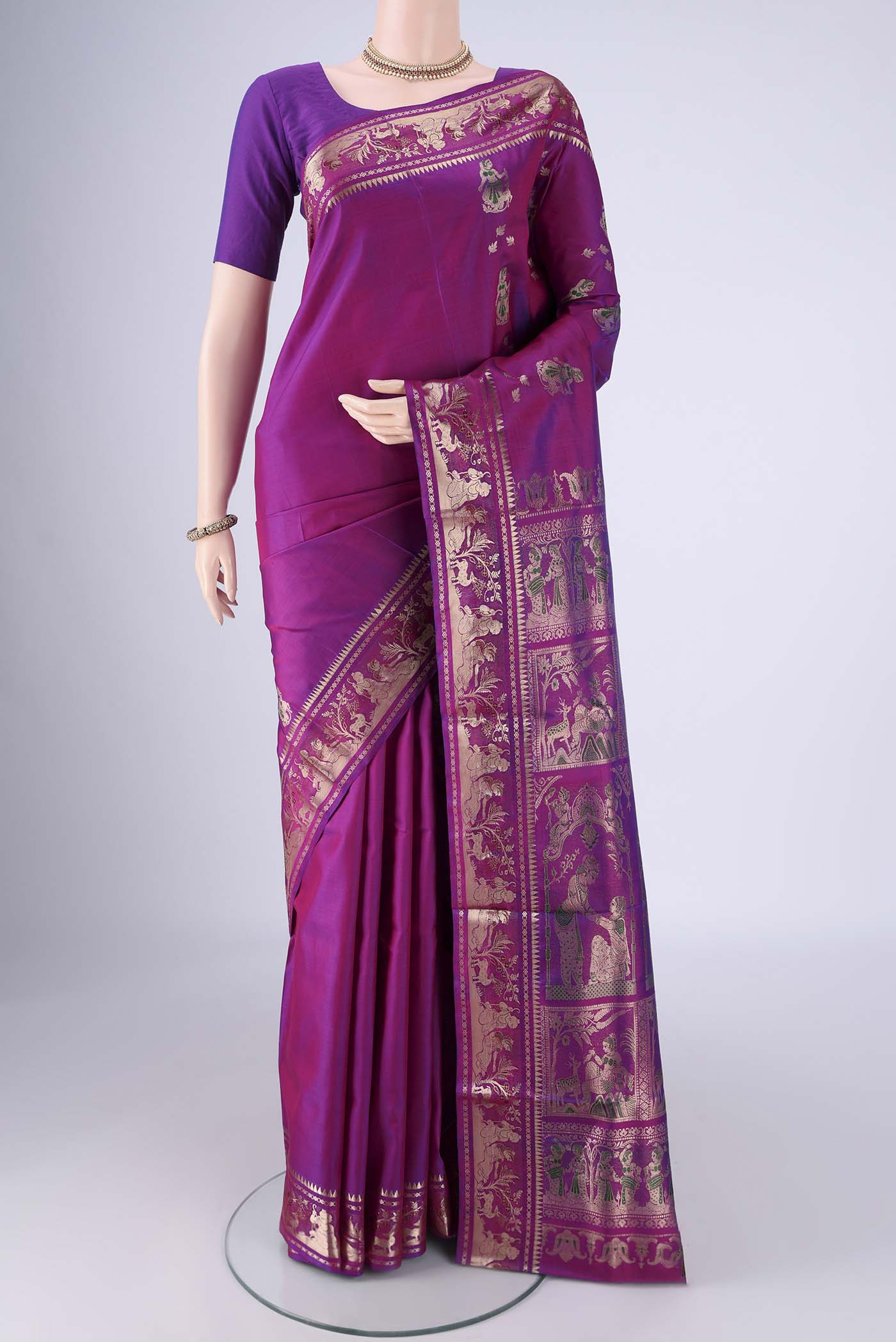 Purple Baluchari Silk Saree with Zari And Thread Butta on the body and Zari And Thread Border.  displayed on a mannequin