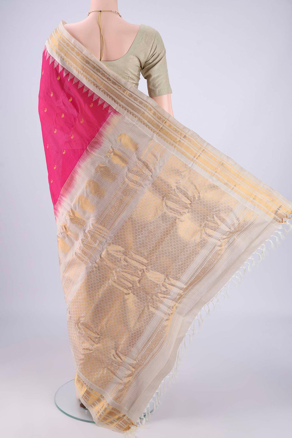 Flat view of Rani Pink Gadwal Silk Cotton Saree with Zari Butta on the body and Zari Border. 