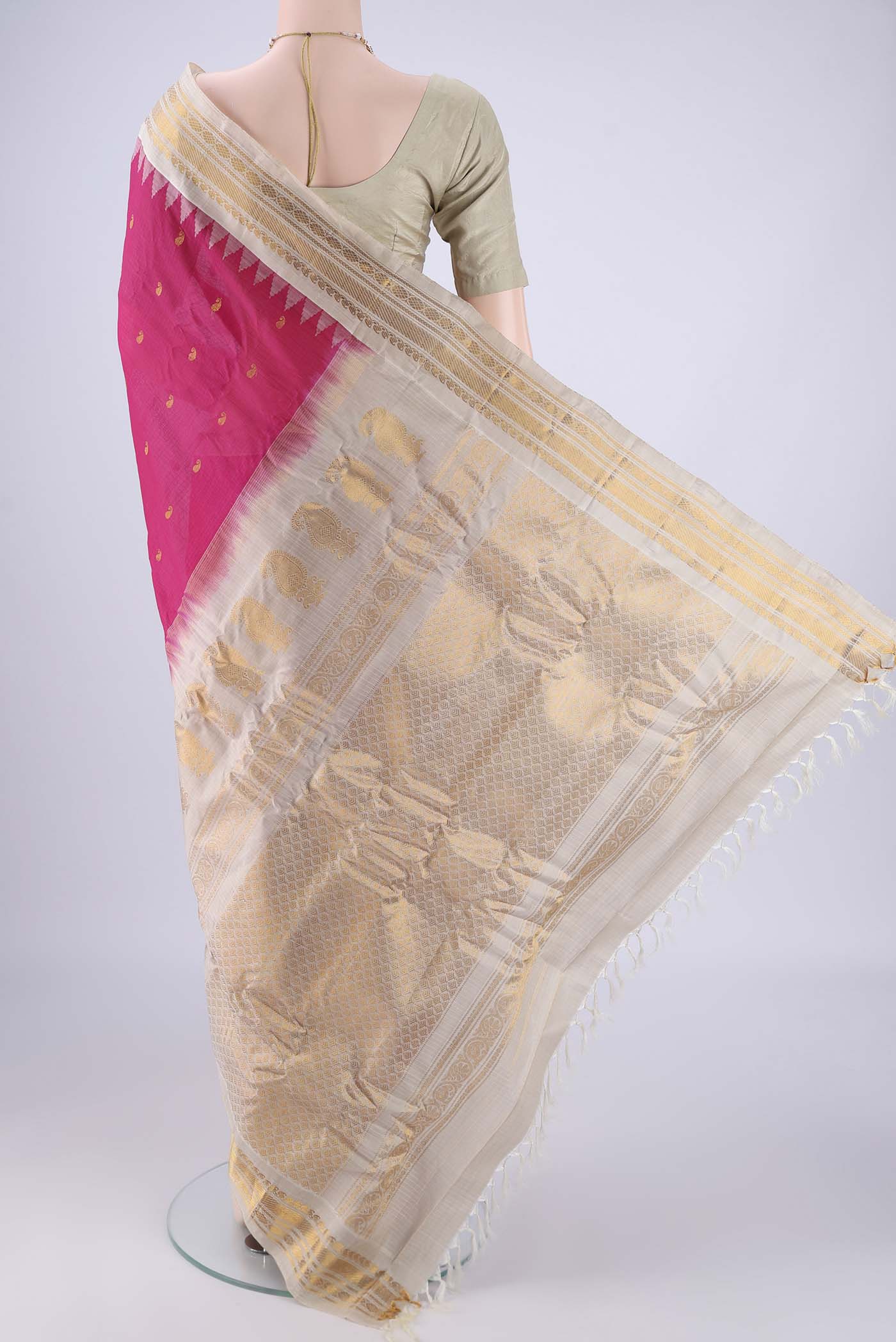 Flat view of Rani Pink Gadwal Silk Cotton Saree with Zari Butta on the body and Zari Border. 
