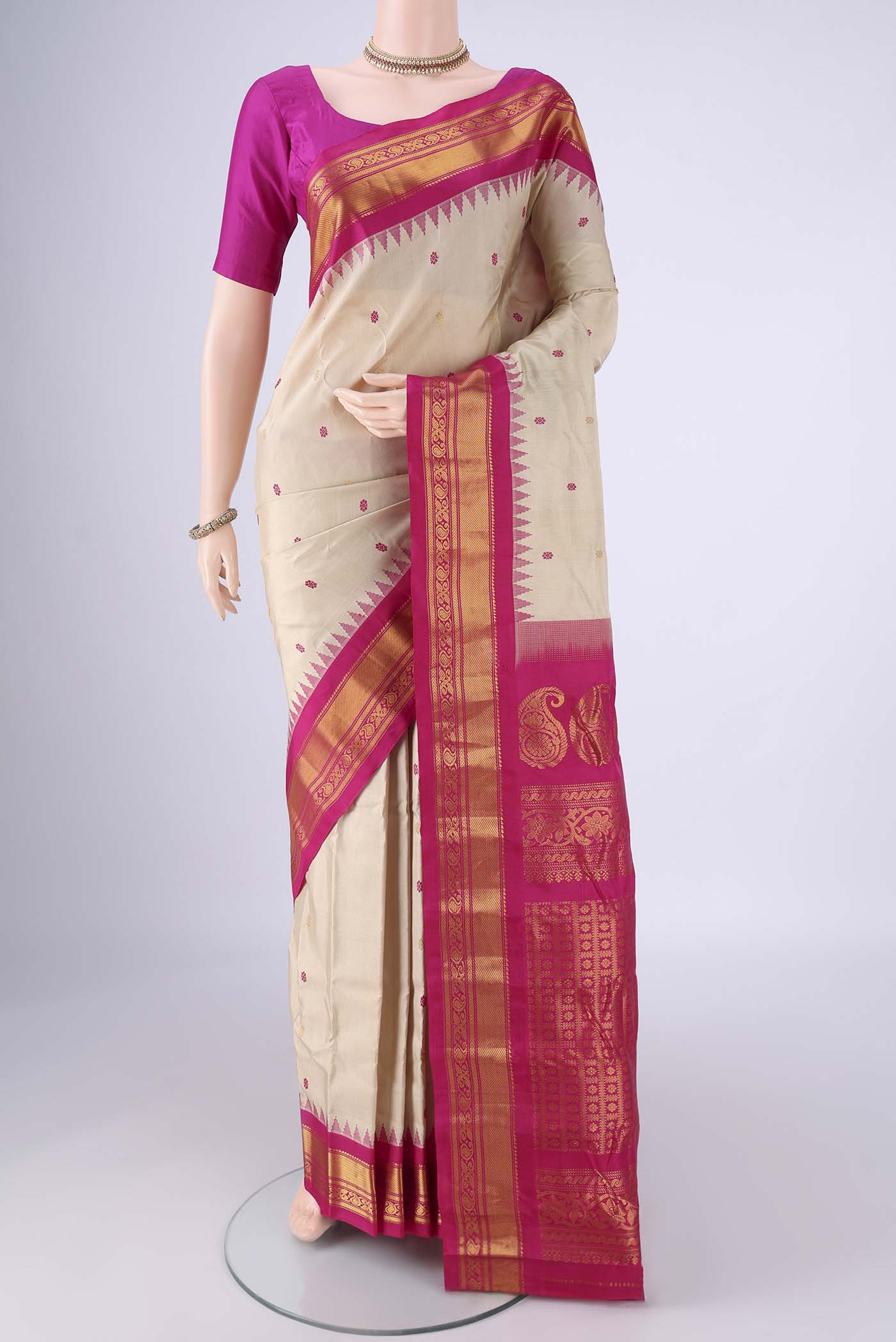 Beige Gadwal Silk Saree with Zari And Thread Butta on the body and Zari Border.  displayed on a mannequin