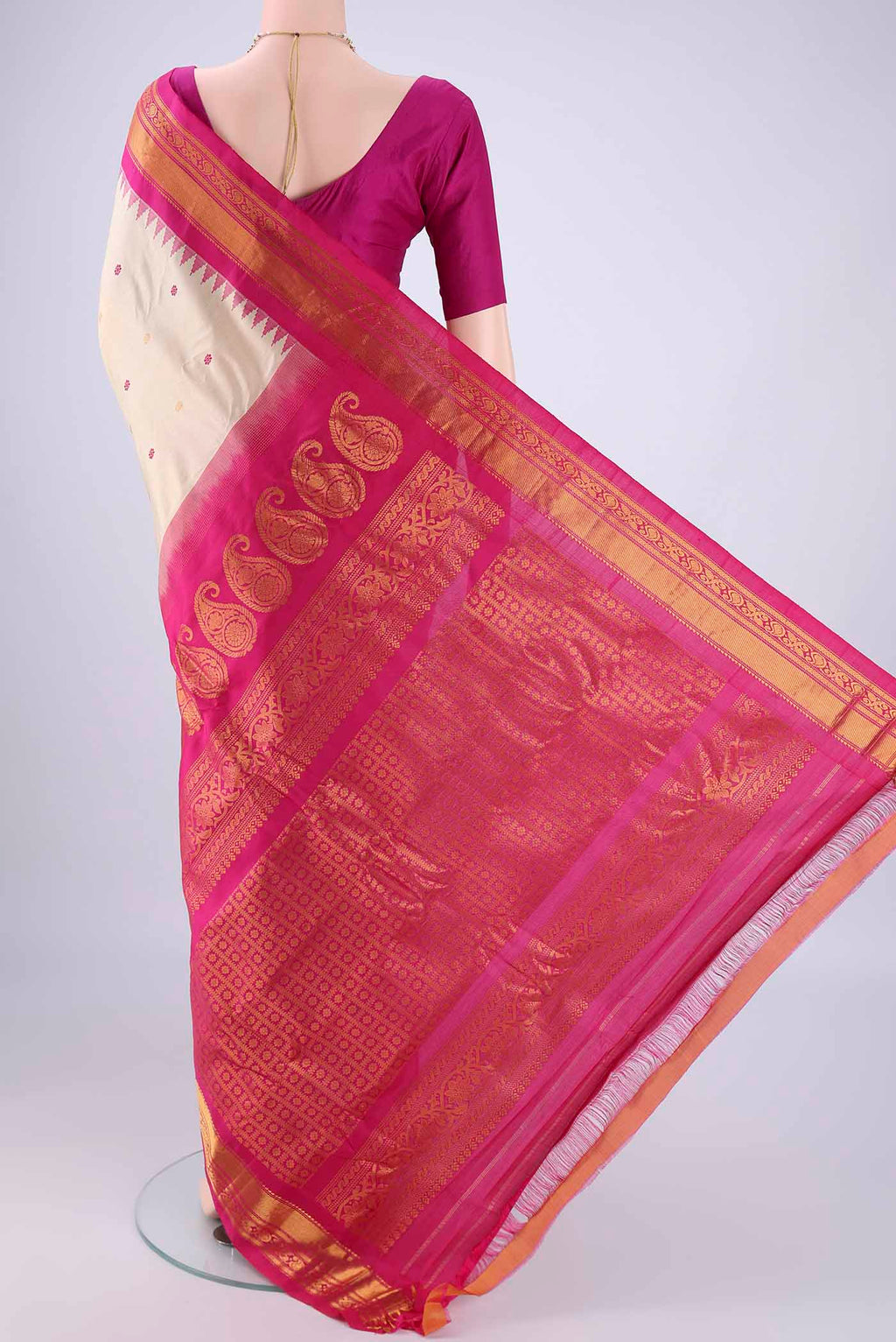 Flat view of Beige Gadwal Silk Saree with Zari And Thread Butta on the body and Zari Border. 