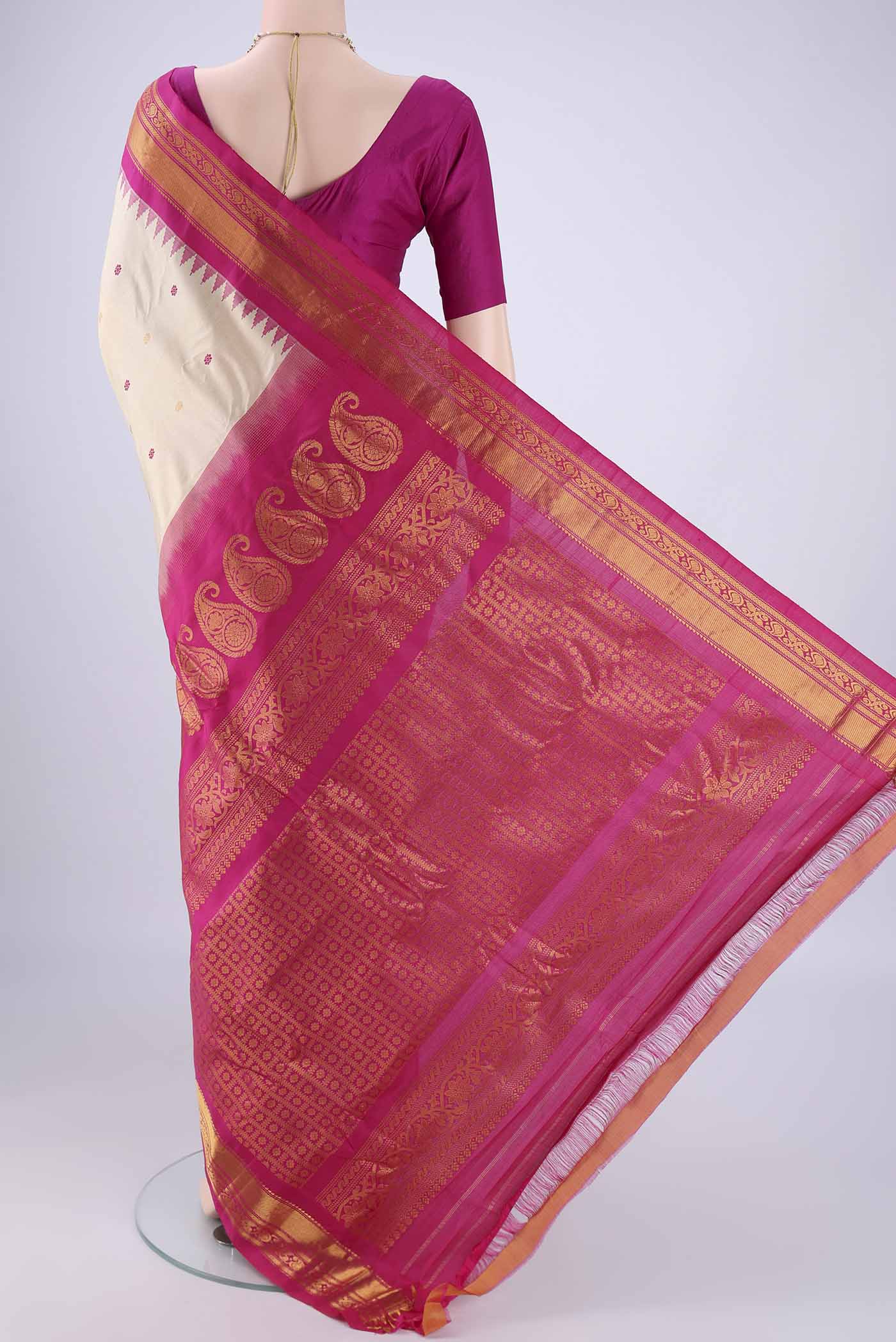 Flat view of Beige Gadwal Silk Saree with Zari And Thread Butta on the body and Zari Border. 
