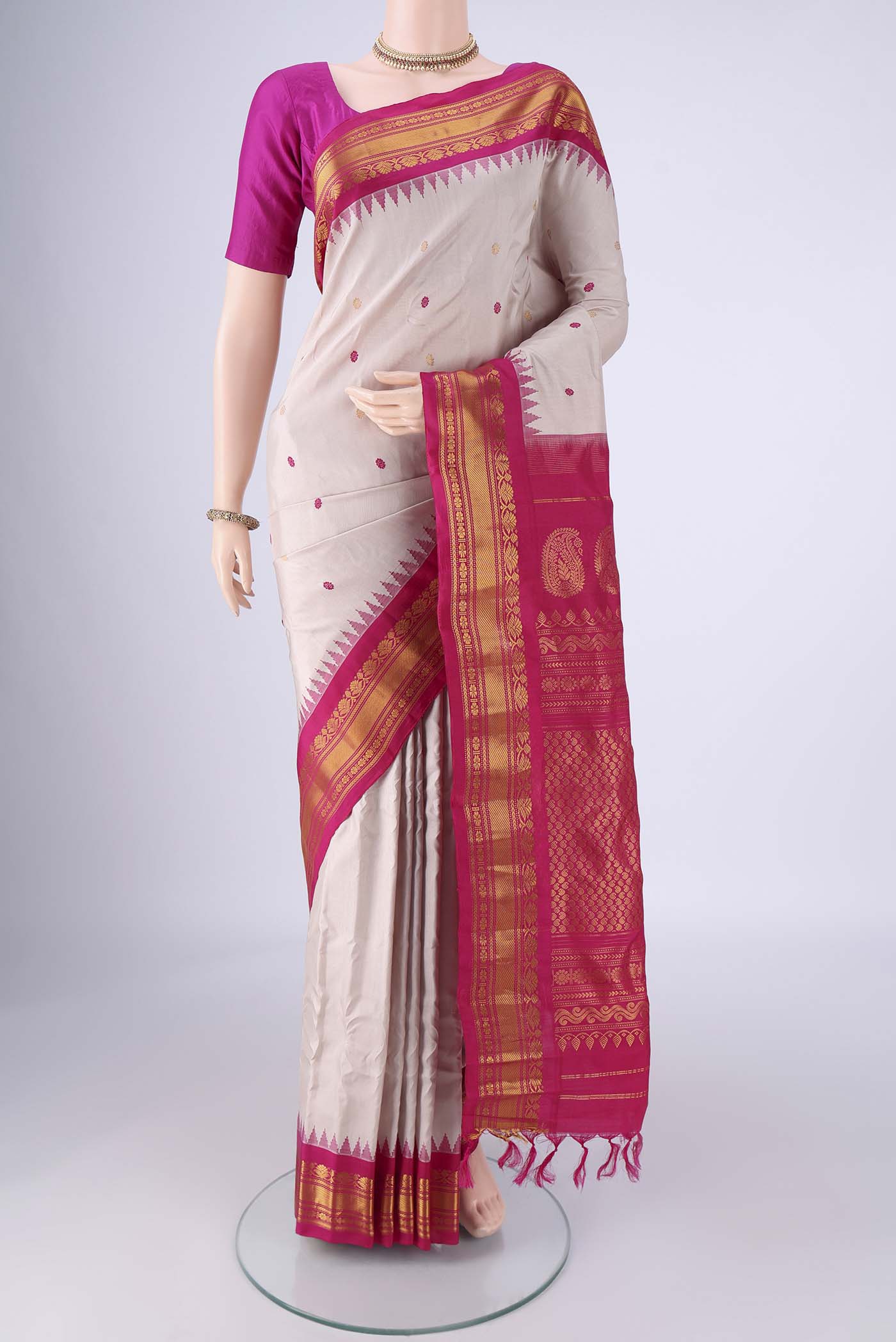 Beige Gadwal Silk Saree with Zari And Thread Butta on the body and Zari Border.  displayed on a mannequin