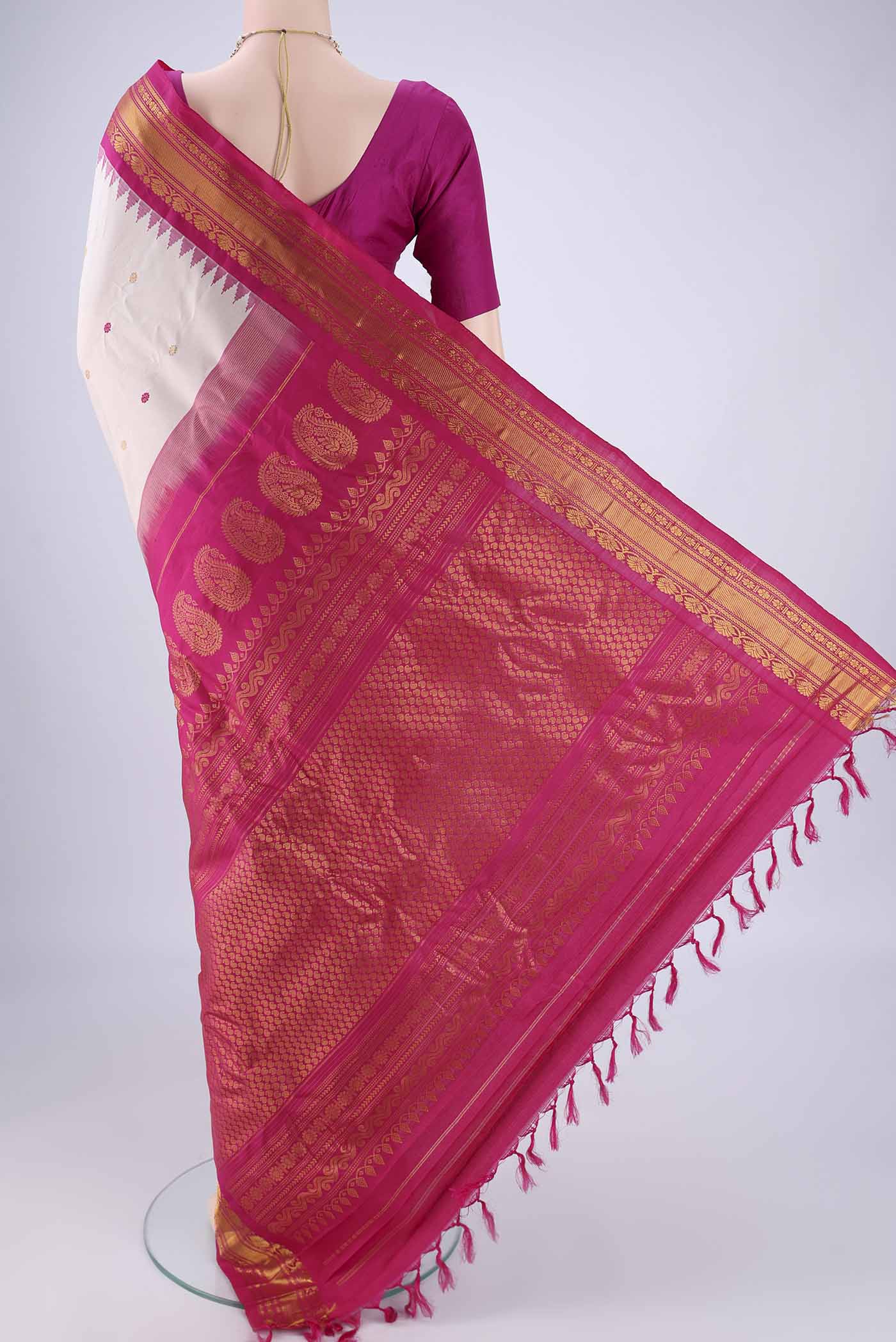 Flat view of Beige Gadwal Silk Saree with Zari And Thread Butta on the body and Zari Border. 