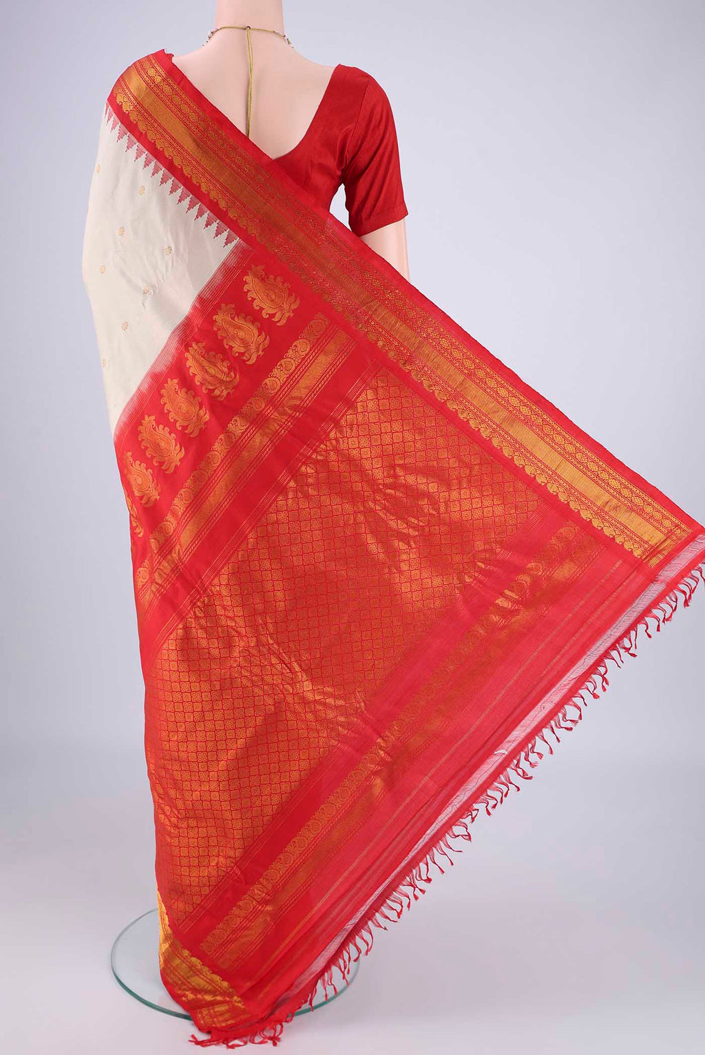 Flat view of Beige Gadwal Silk Saree with Zari Butta on the body and Zari Border. 