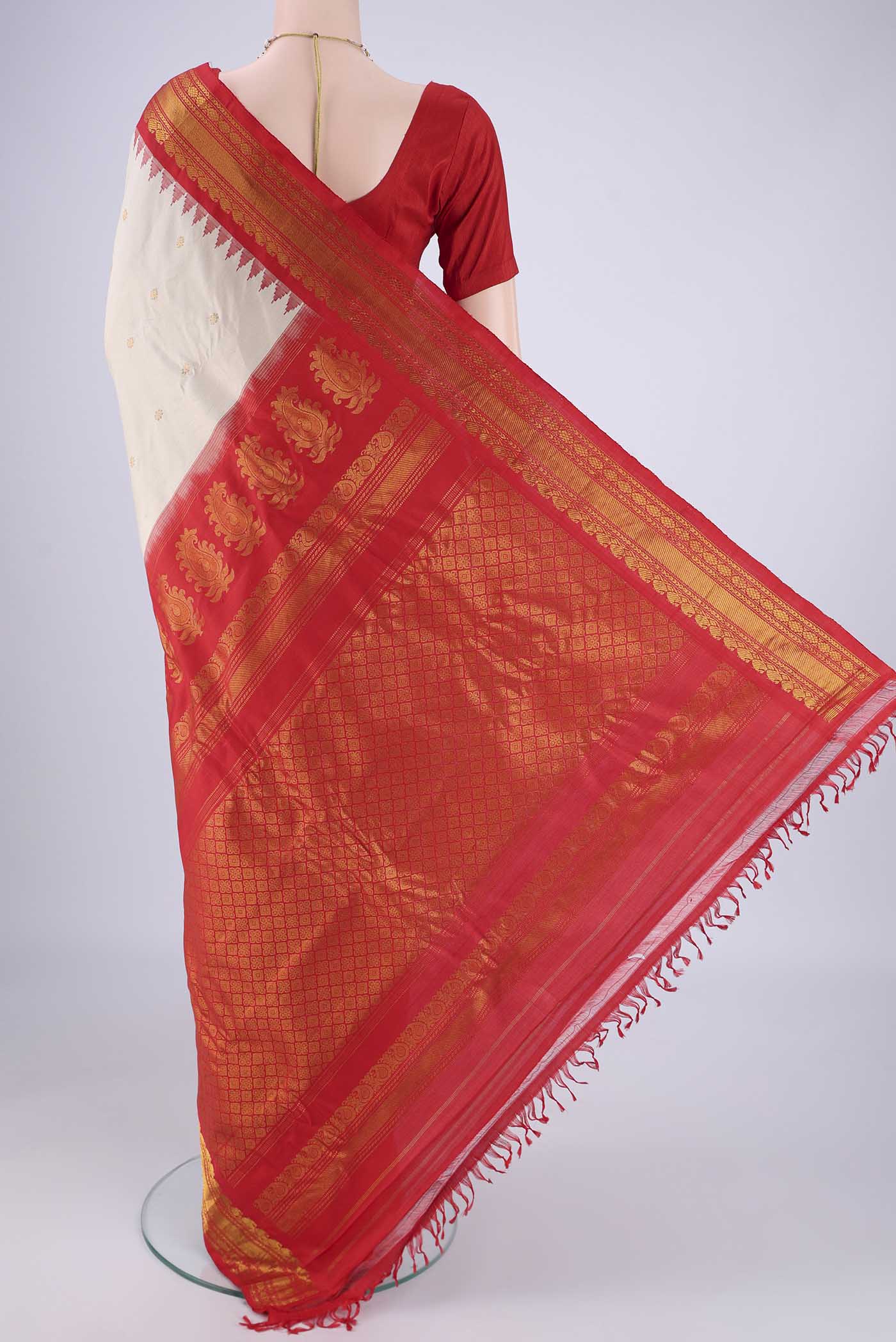 Flat view of Beige Gadwal Silk Saree with Zari Butta on the body and Zari Border. 
