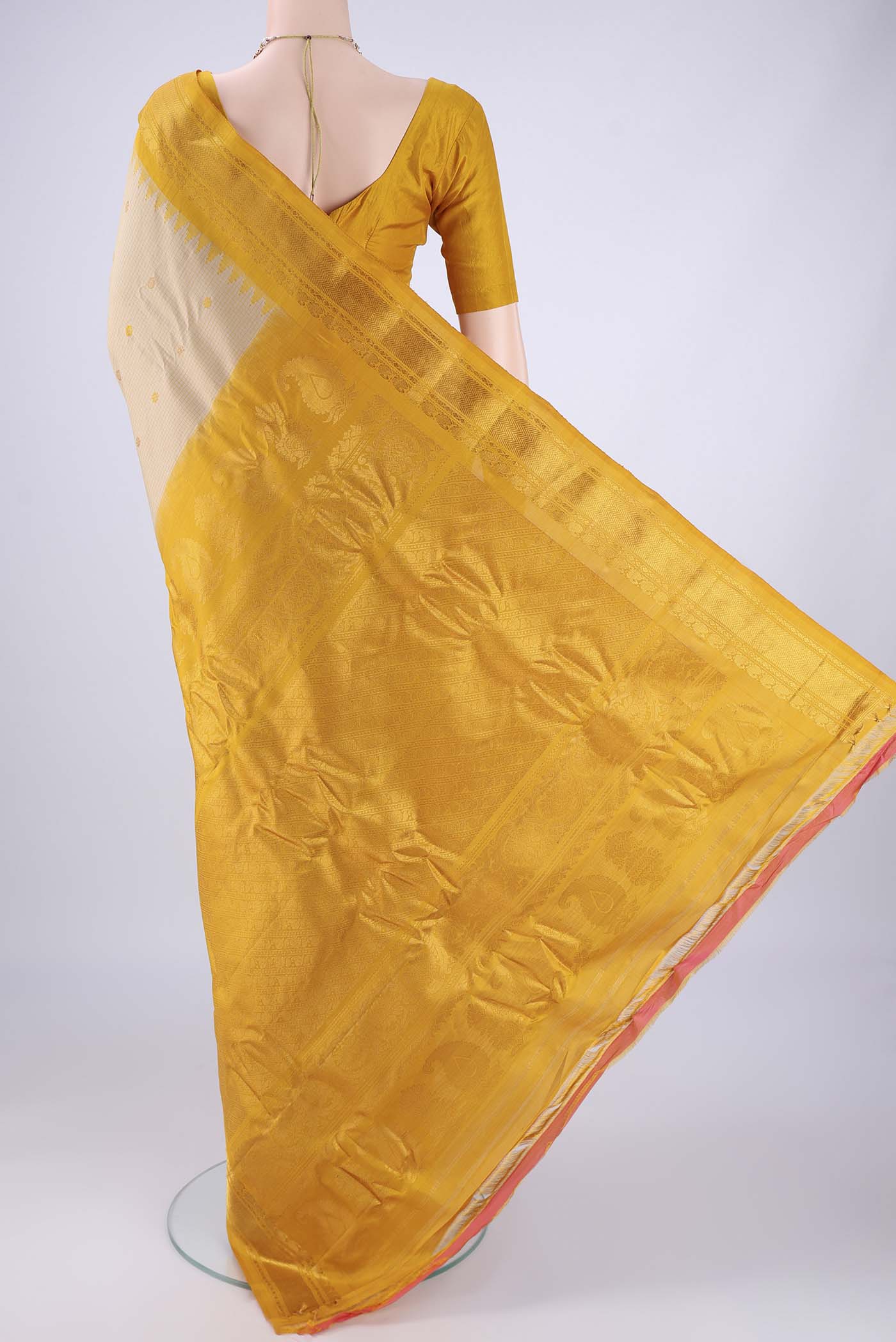 Flat view of Beige Gadwal Silk Saree with Checked design on the body and Zari Border. 