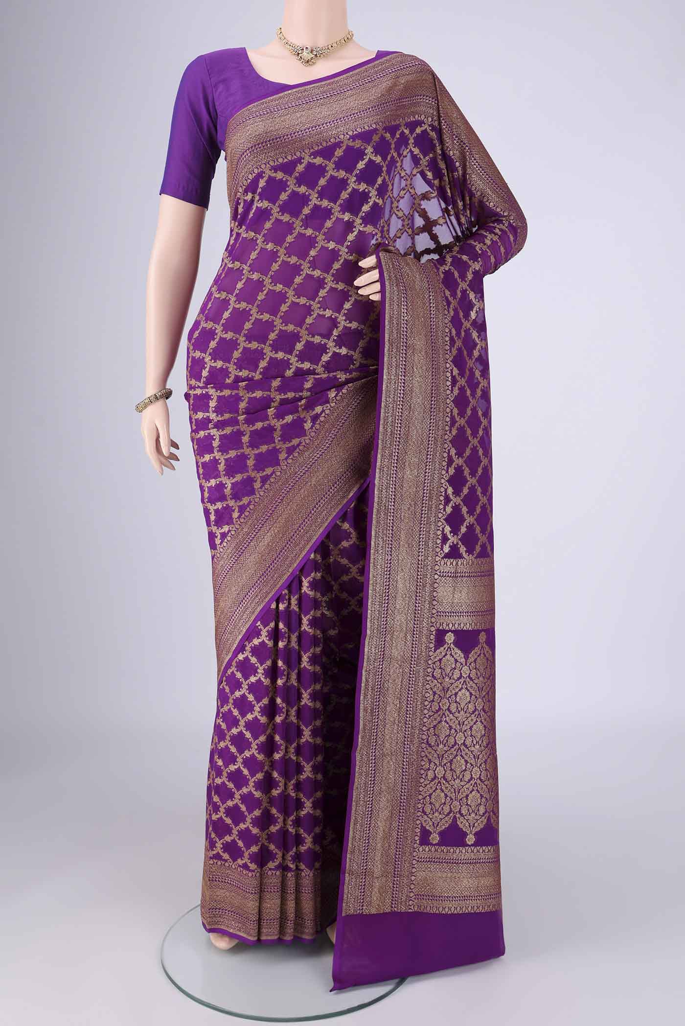 Purple Banarasi Georgette Saree with Zari Brocade on the body and Zari Border.  displayed on a mannequin