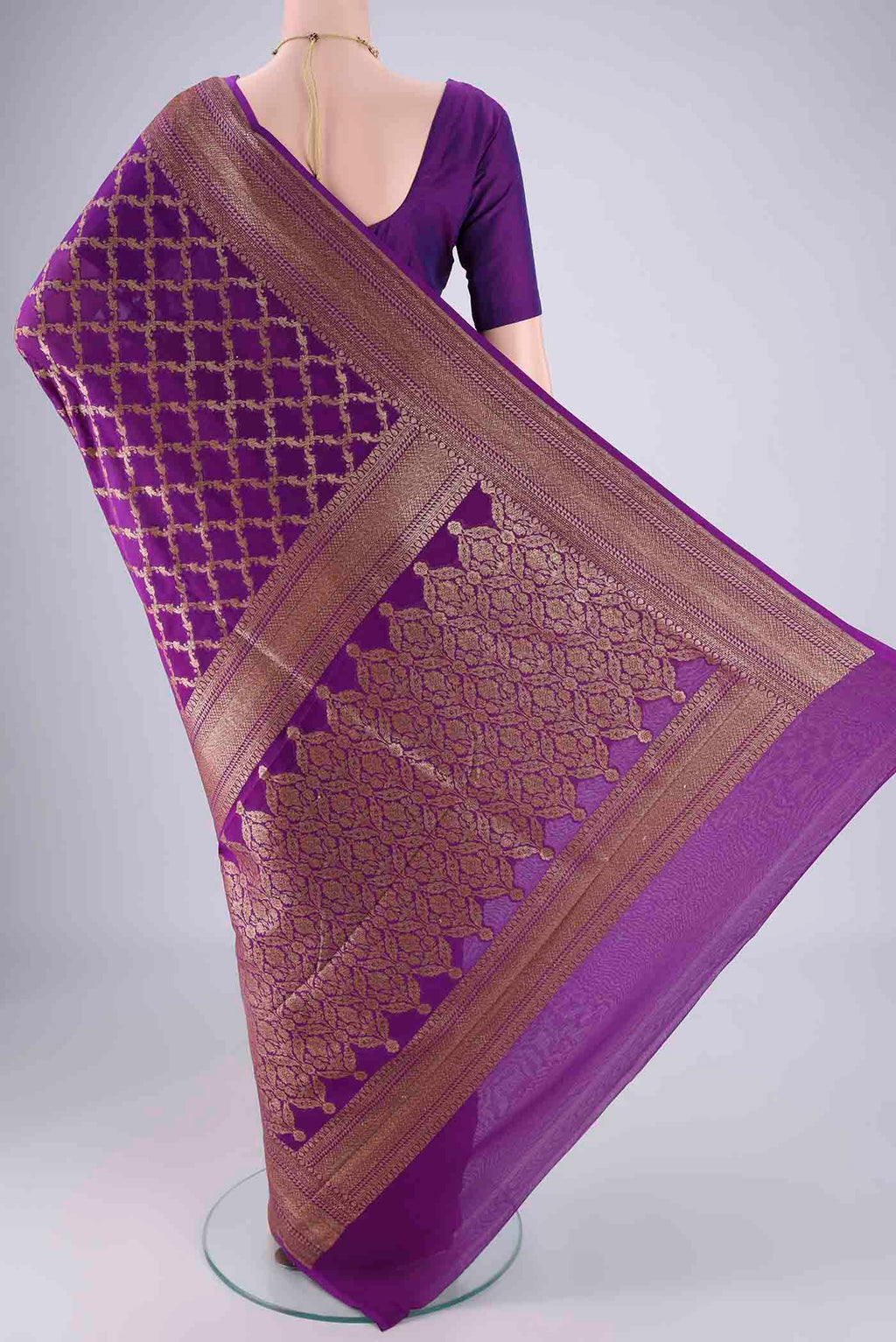 Flat view of Purple Banarasi Georgette Saree with Zari Brocade on the body and Zari Border. 