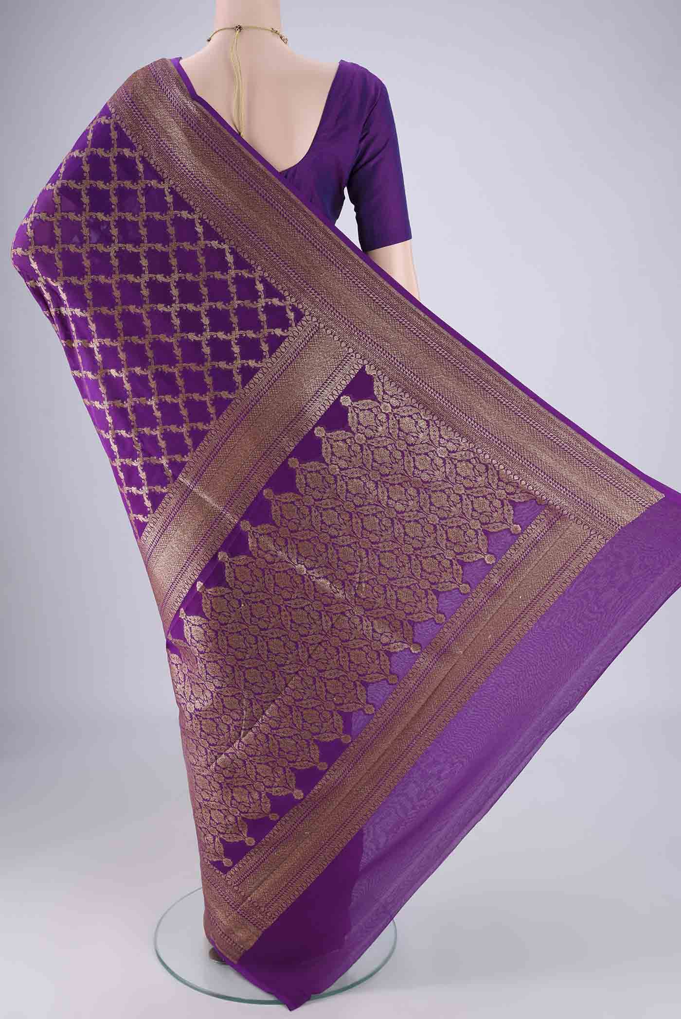 Flat view of Purple Banarasi Georgette Saree with Zari Brocade on the body and Zari Border. 