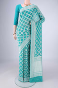 Light Blue Banarasi Georgette Saree with Zari Brocade on the body and Zari Border.  displayed on a mannequin