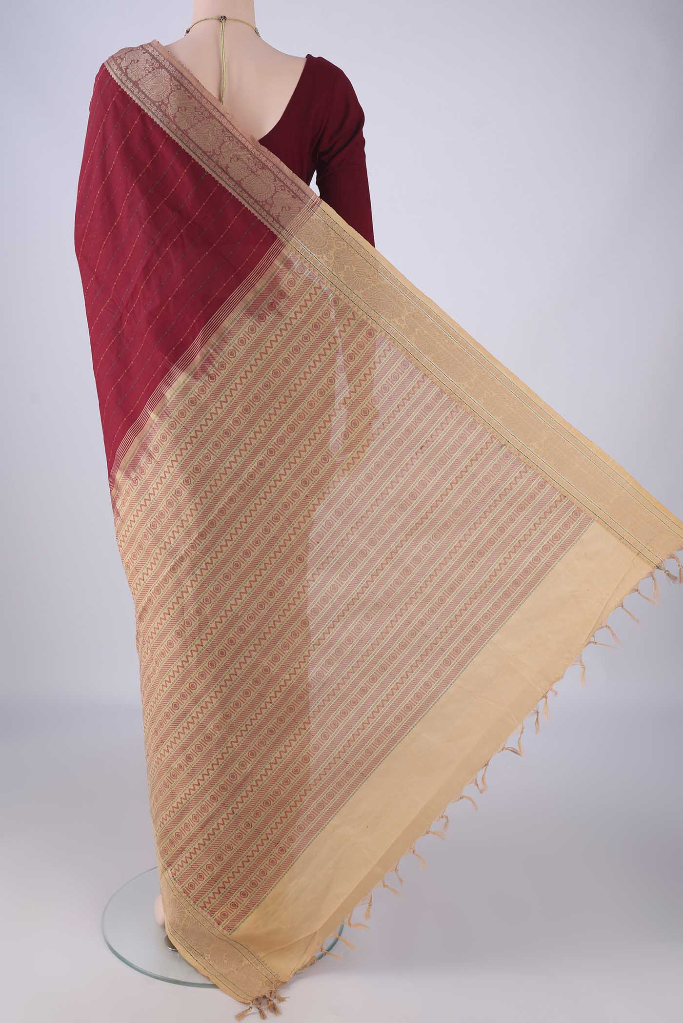 Flat view of Maroon Blended Poly Cotton Saree with Stripes on the body and Thread Border. 