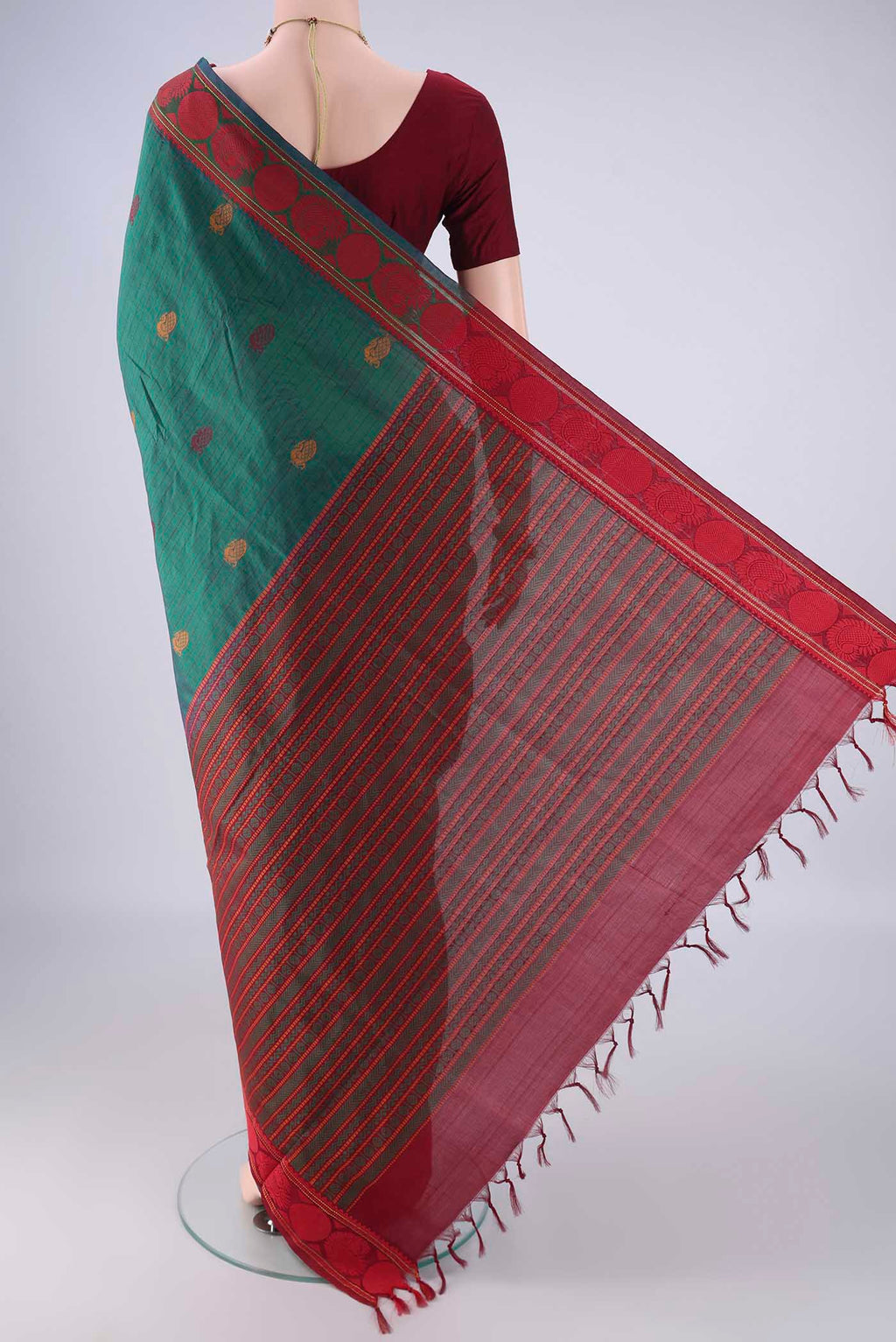 Flat view of Bottle Green Poly Cotton Saree with Checked design on the body and Thread Border. 