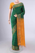 Green Blended Poly Cotton Saree with Checked design on the body and Ikat Border.  displayed on a mannequin