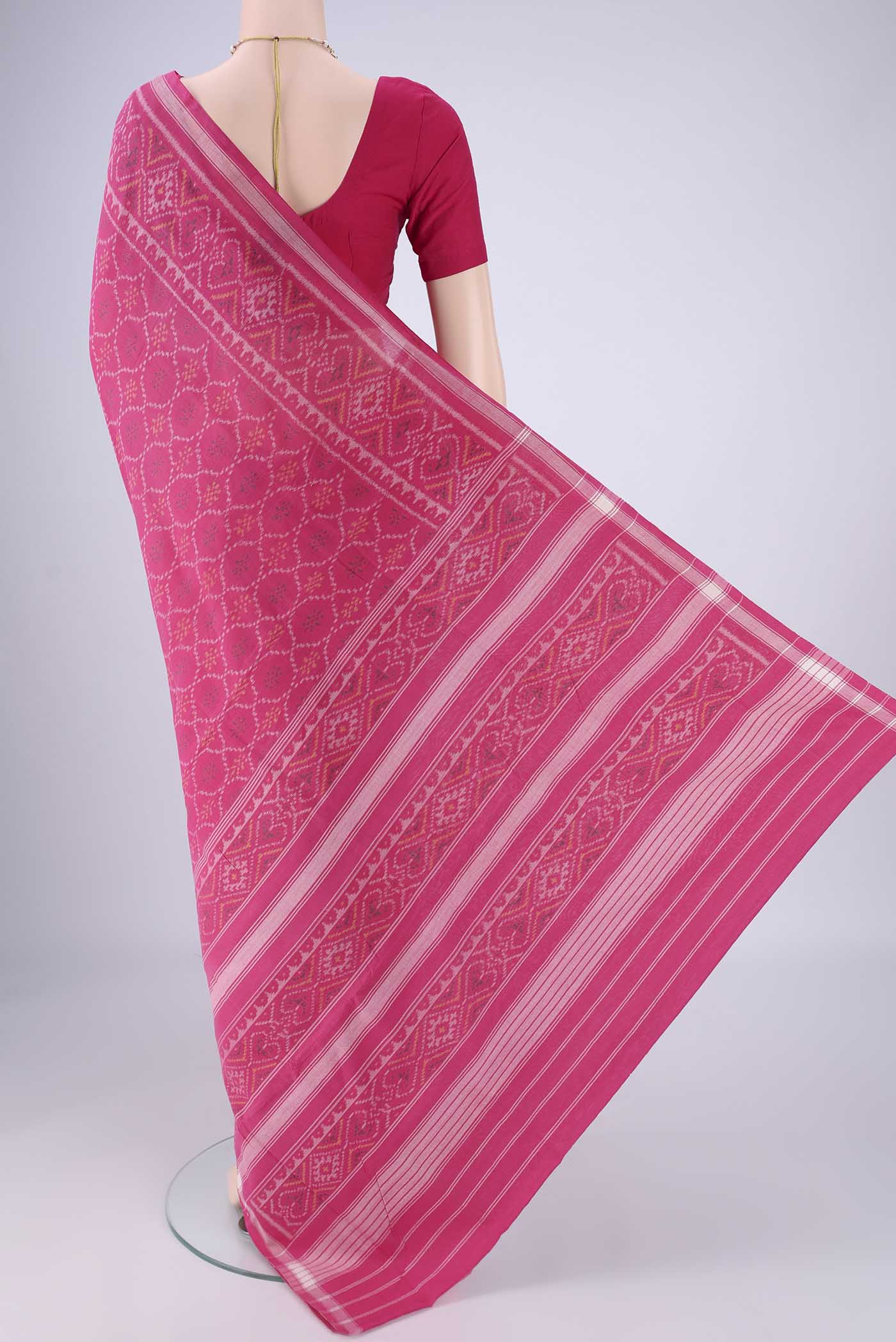Flat view of Rani Pink Pochampally Cotton Saree with Pure Ikat on the body and Ikat Border. 