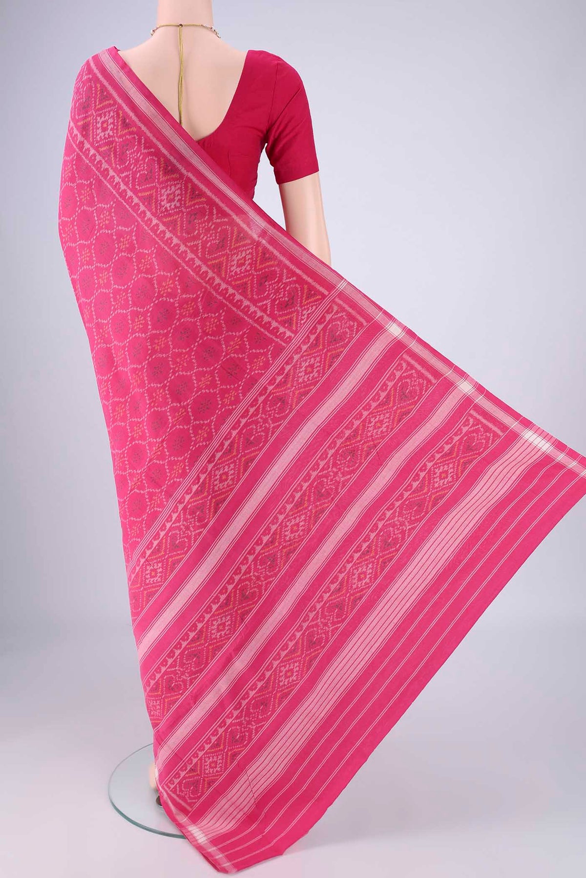 Flat view of Rani Pink Pochampally Cotton Saree with Pure Ikat on the body and Ikat Border. 