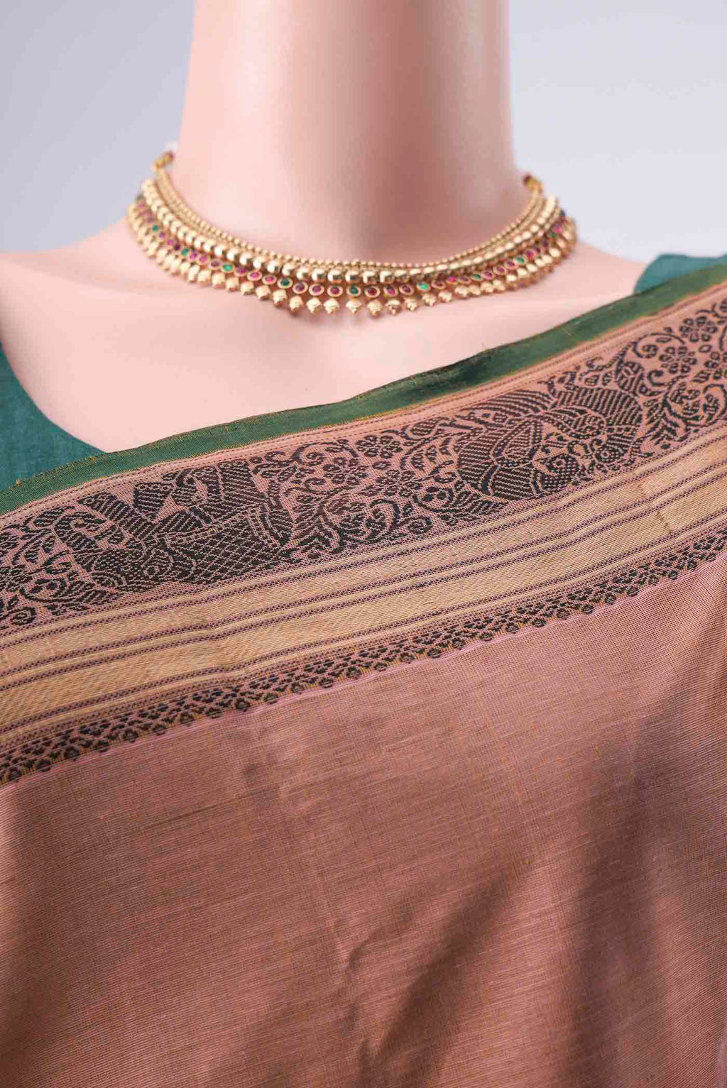 Border image of Coral Kanchi Cotton Saree with Thread Butta on the body and Zari Border. 