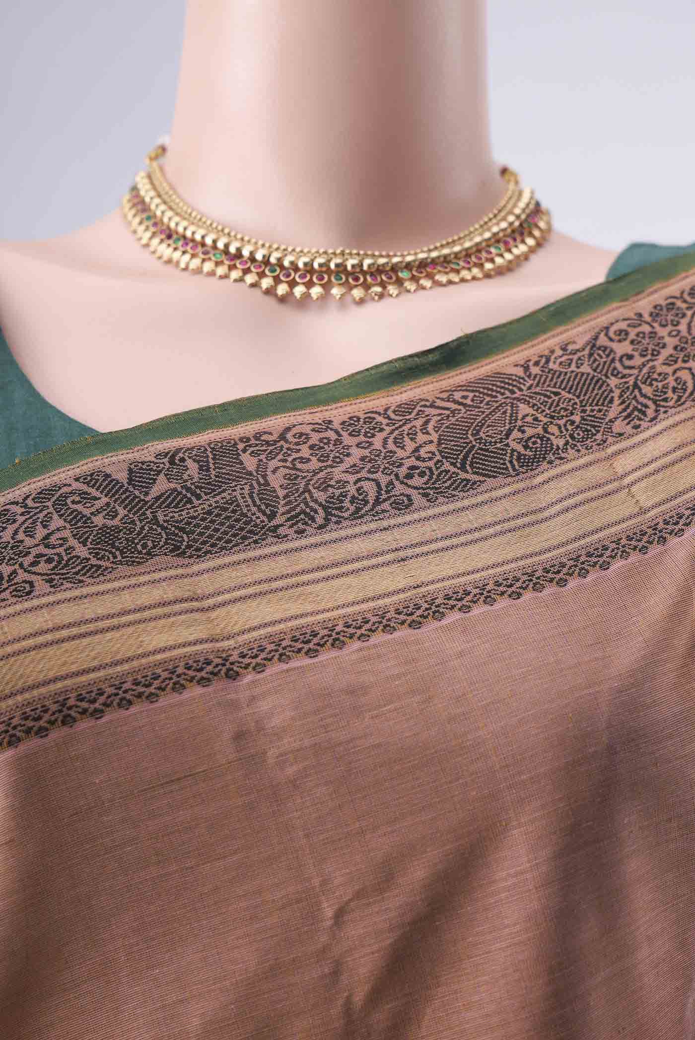 Border image of Coral Kanchi Cotton Saree with Thread Butta on the body and Zari Border. 
