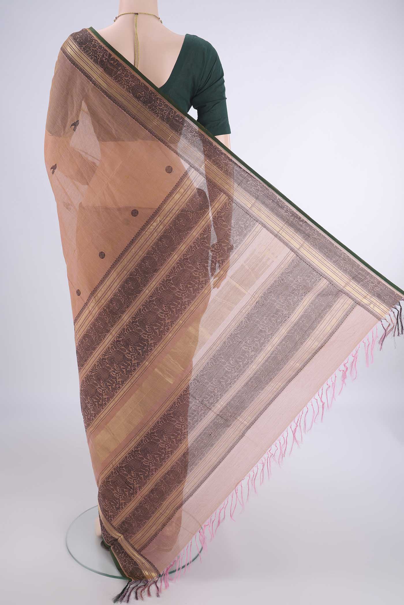 Flat view of Coral Kanchi Cotton Saree with Thread Butta on the body and Zari Border. 