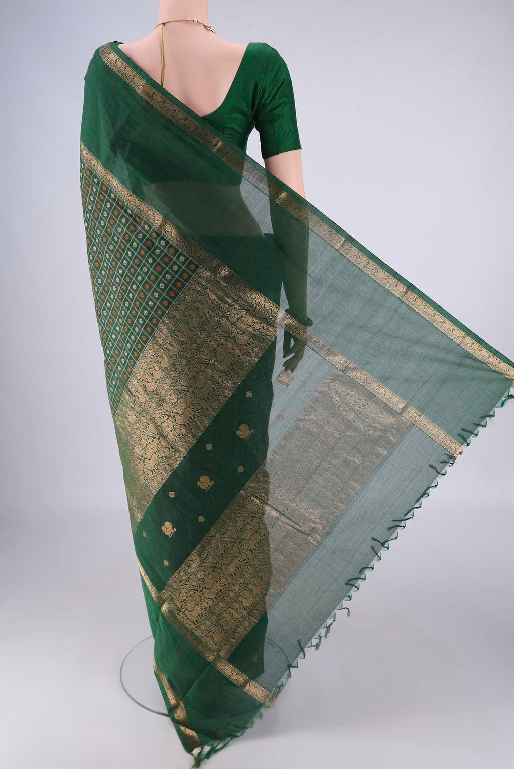 Flat view of Bottle Green Kanchi Cotton Saree with Checked design on the body and Zari Border. 