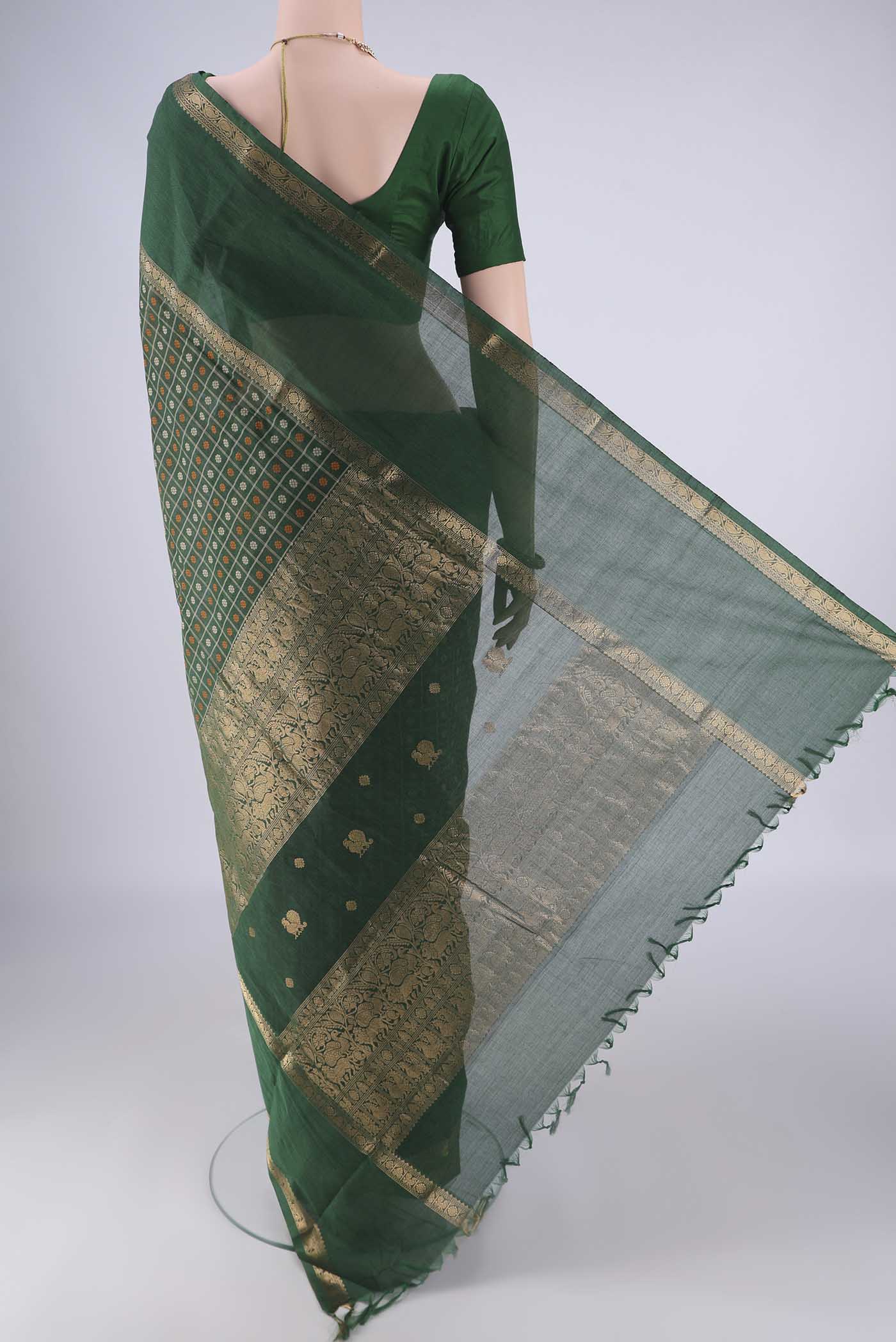 Flat view of Bottle Green Kanchi Cotton Saree with Checked design on the body and Zari Border. 