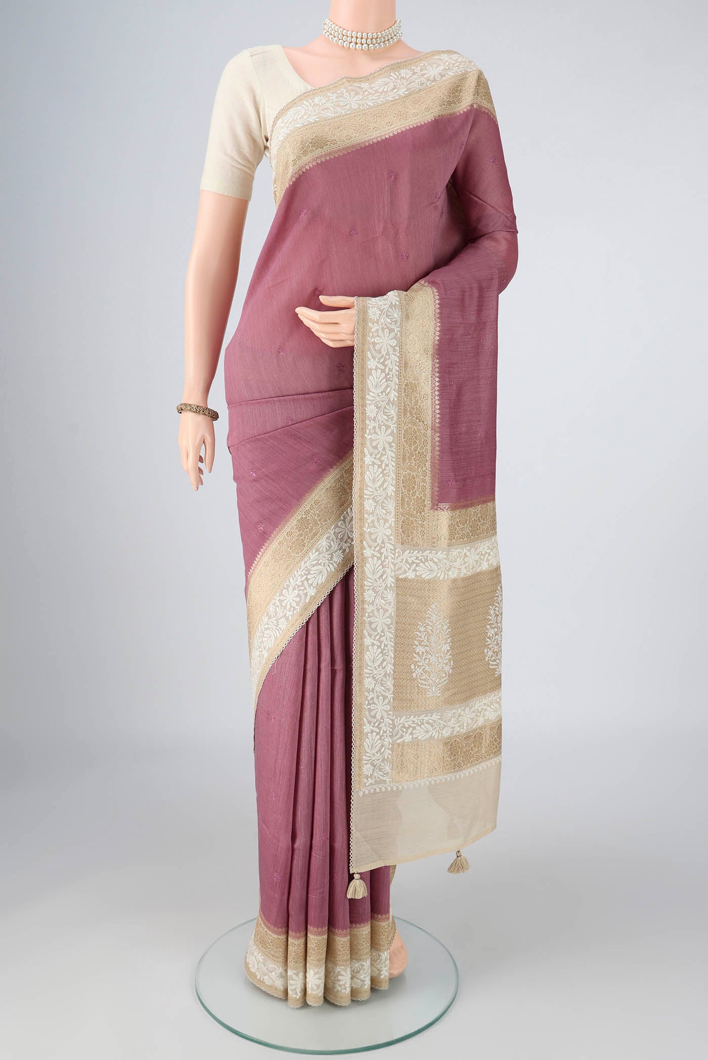 Mauve MP Tussar Saree with Embroidery on the body and Zari And Thread Border.  displayed on a mannequin
