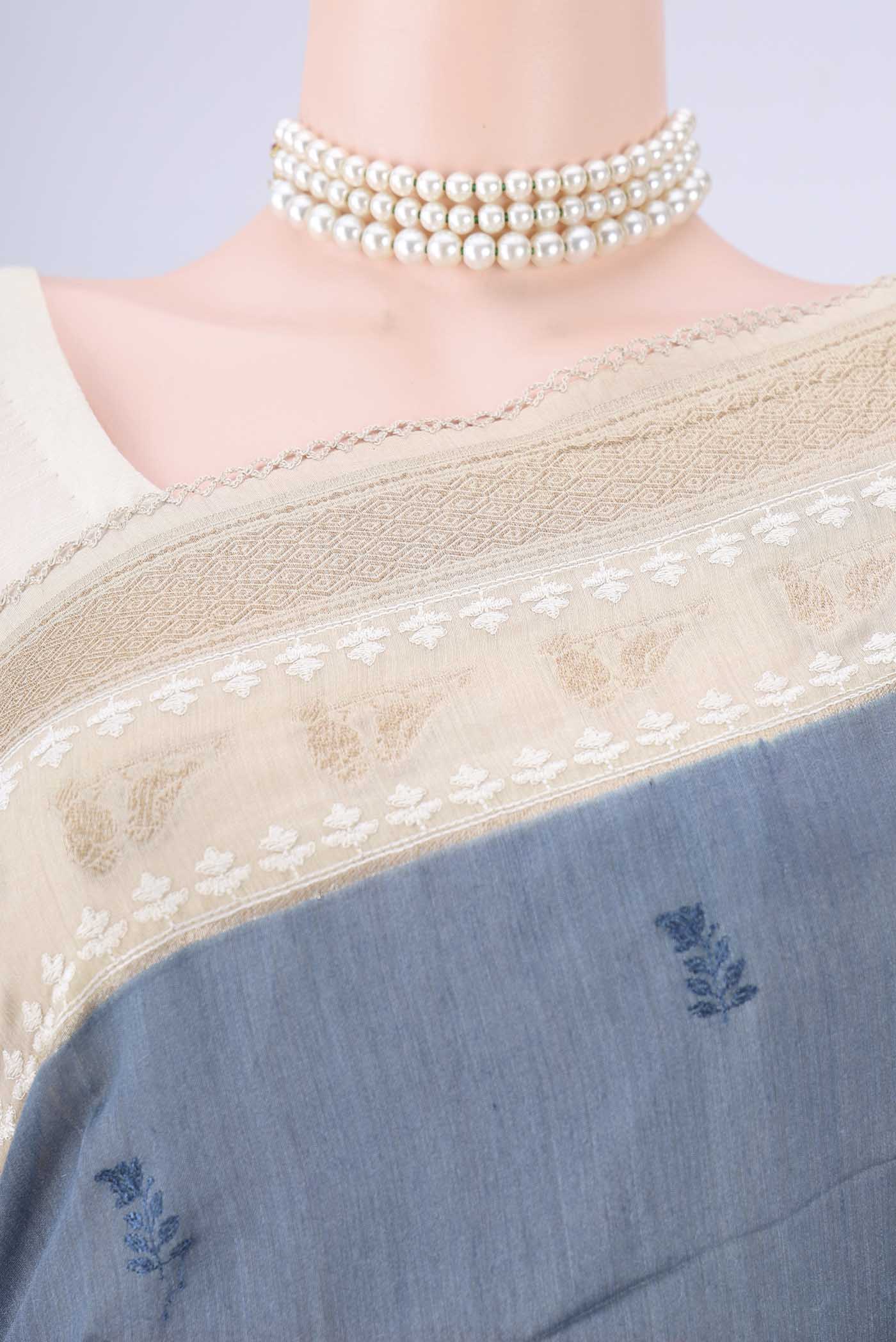 Border image of Blue Grey MP Tussar Saree with Embroidery on the body and Zari And Thread Border. 