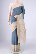 Blue Grey MP Tussar Saree with Embroidery on the body and Zari And Thread Border.  displayed on a mannequin