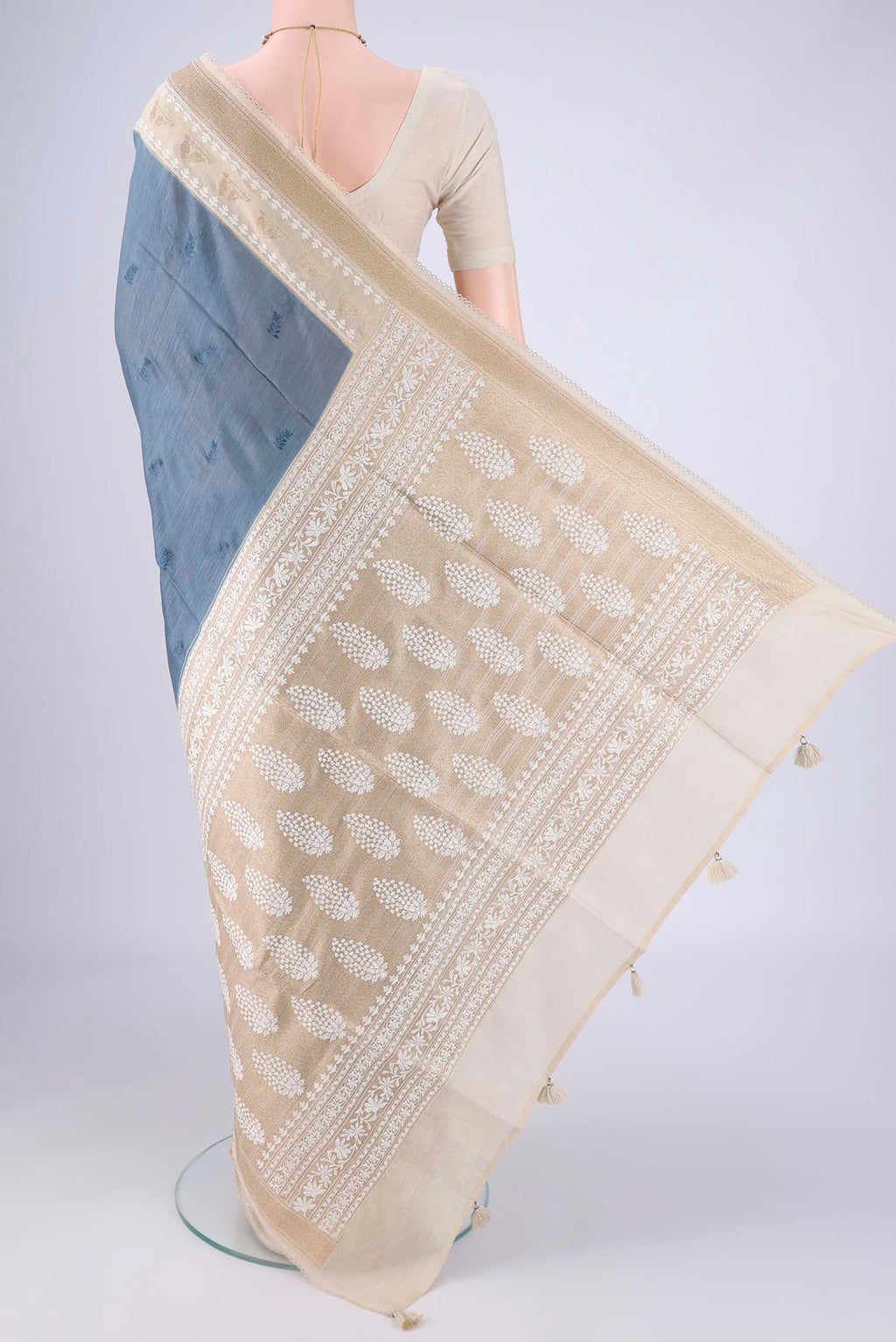 Flat view of Blue Grey MP Tussar Saree with Embroidery on the body and Zari And Thread Border. 