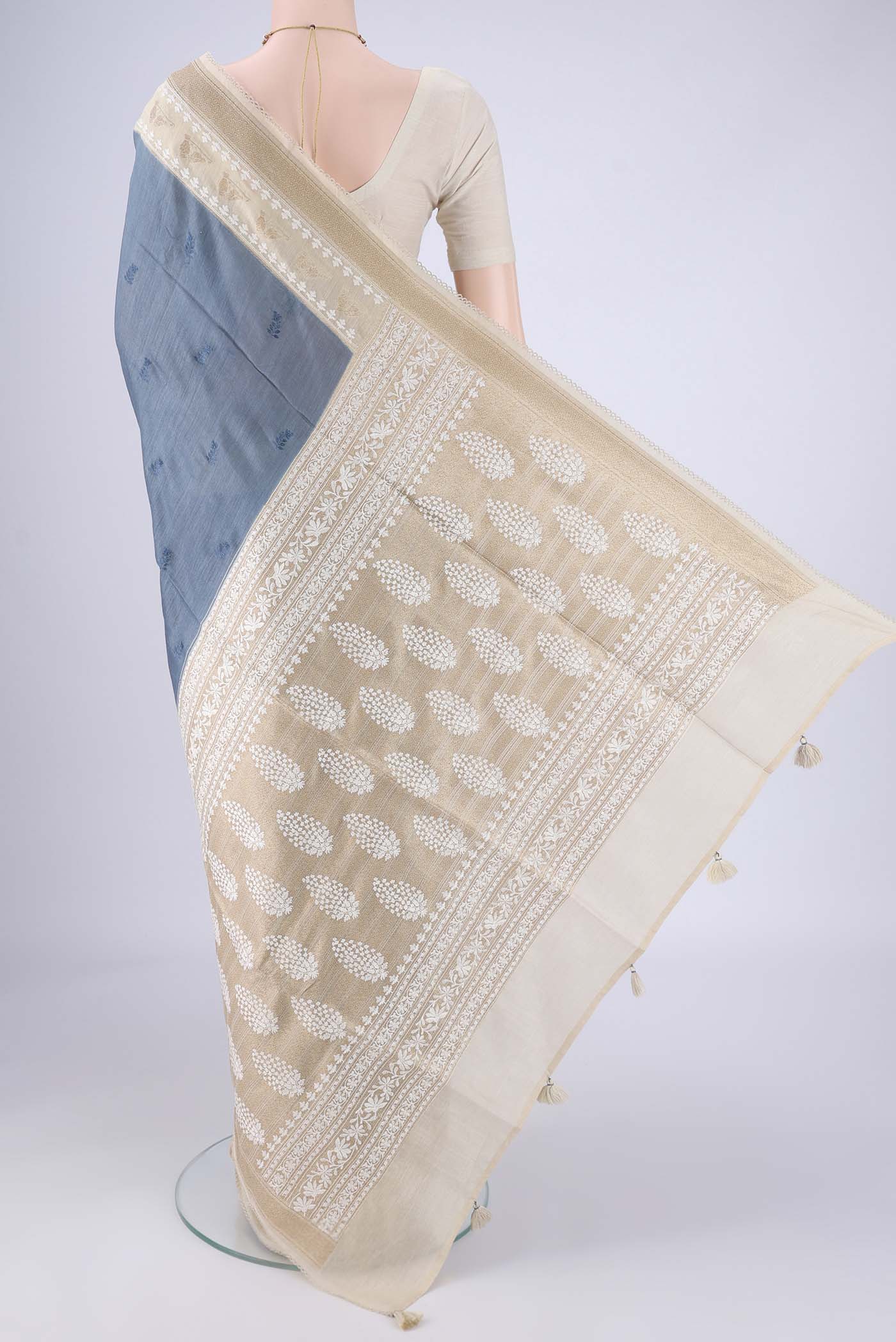 Flat view of Blue Grey MP Tussar Saree with Embroidery on the body and Zari And Thread Border. 
