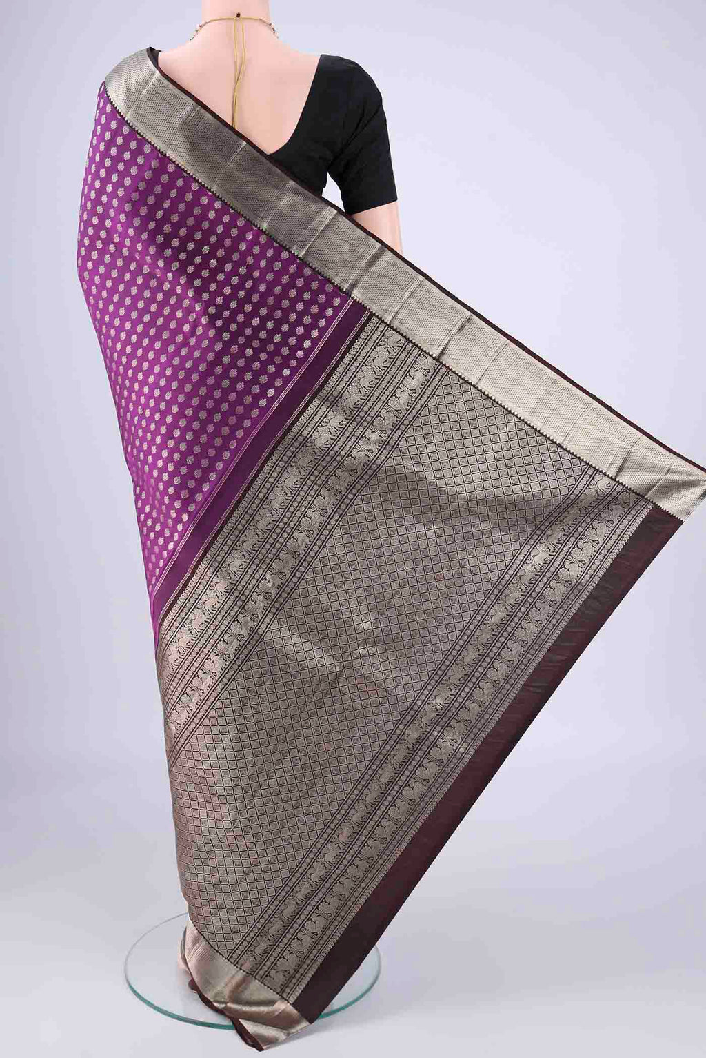 Flat view of Purple Kanchipuram Silk Saree with Zari Butta on the body and Zari Border. 