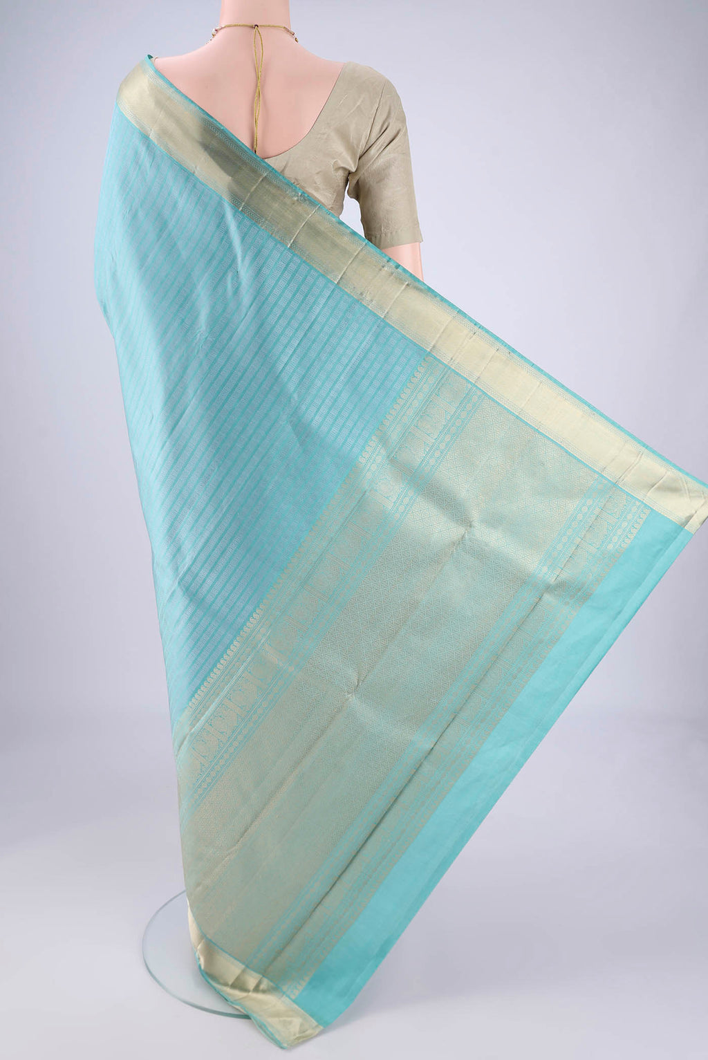 Flat view of Sky Blue Kanchipuram Silk Saree with Jacquard design on the body and Zari Border. 