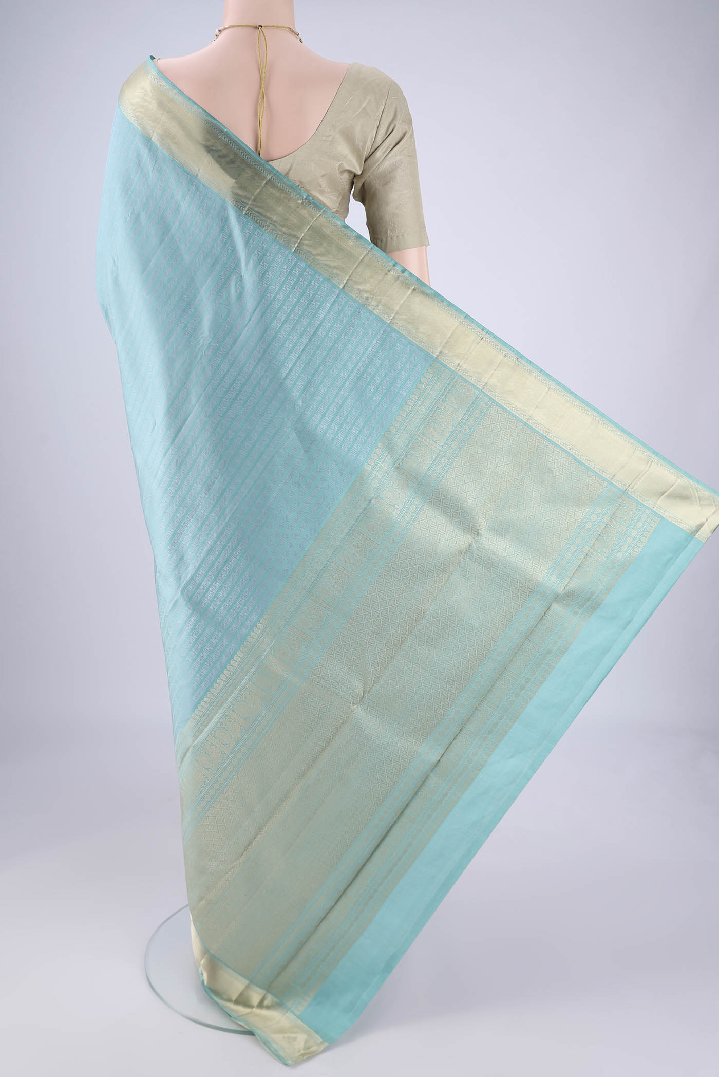 Flat view of Sky Blue Kanchipuram Silk Saree with Jacquard design on the body and Zari Border. 