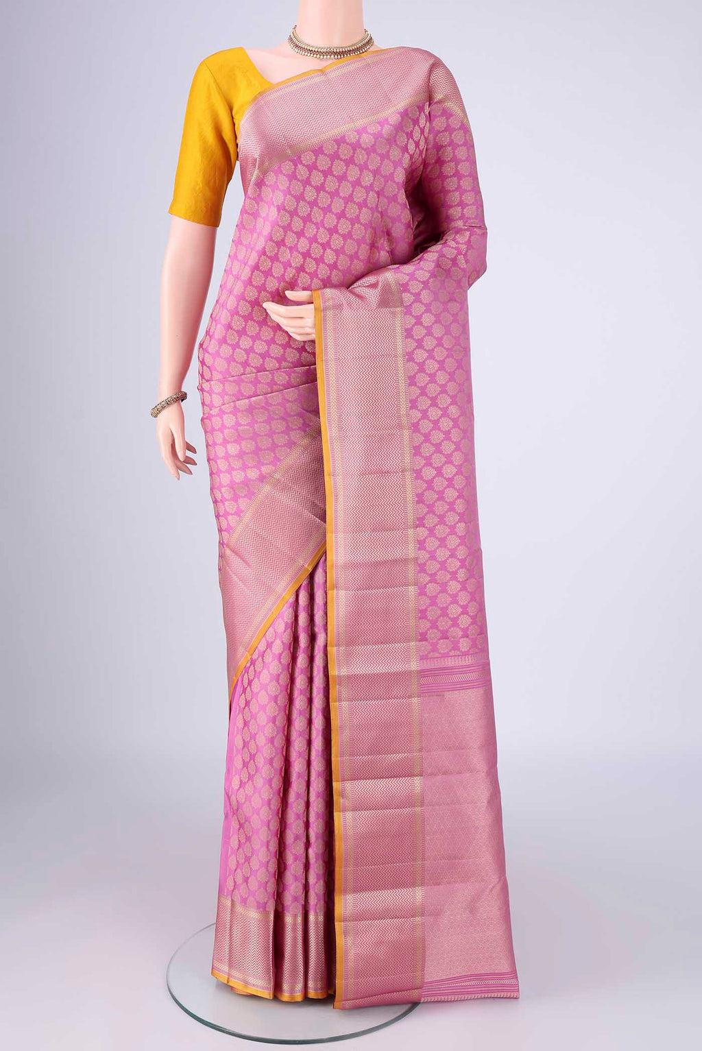Lavender Kanchipuram Silk Saree with Jacquard design on the body and Thread Border.  displayed on a mannequin