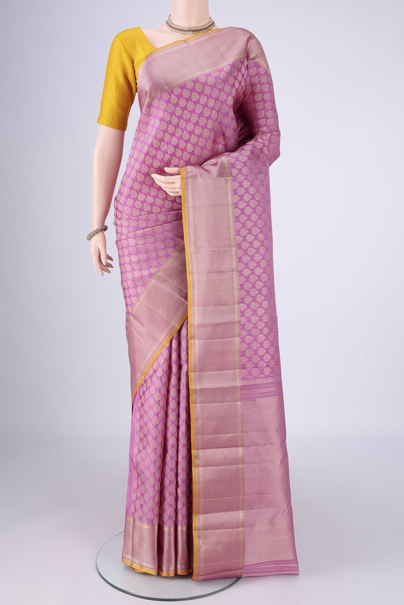 Lavender Kanchipuram Silk Saree with Jacquard design on the body and Thread Border.  displayed on a mannequin
