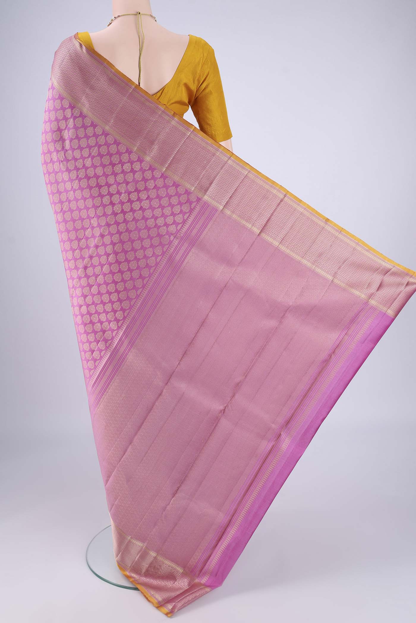 Flat view of Lavender Kanchipuram Silk Saree with Jacquard design on the body and Thread Border. 