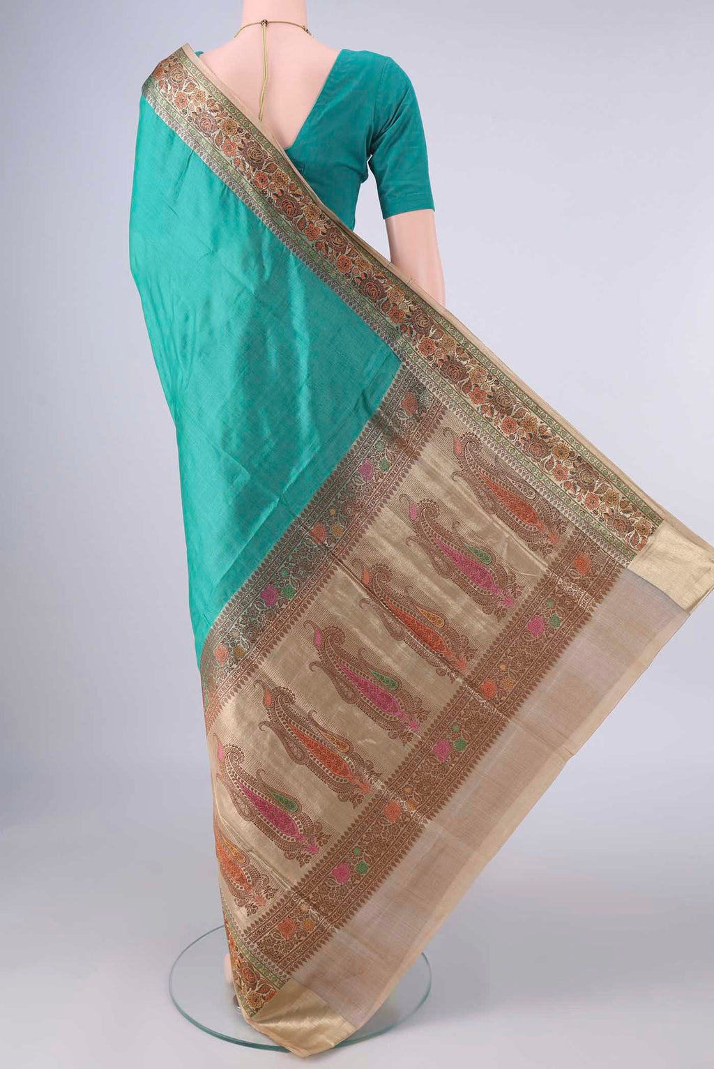 Flat view of Sea Green Banarasi Tussar Saree with Plain Body and Zari Border. 