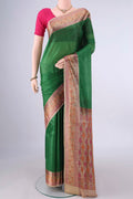 Green Banarasi Tussar Saree with Plain Body and Zari Border.  displayed on a mannequin