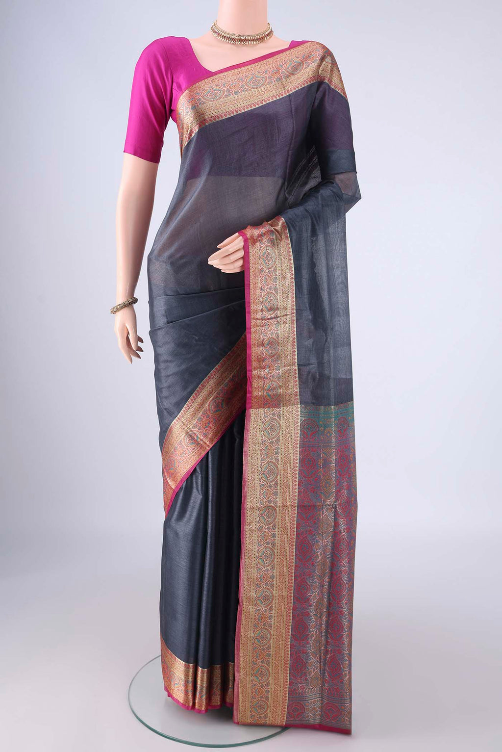 Grey Banarasi Tussar Silk Saree with Plain Body and Zari Border.  displayed on a mannequin