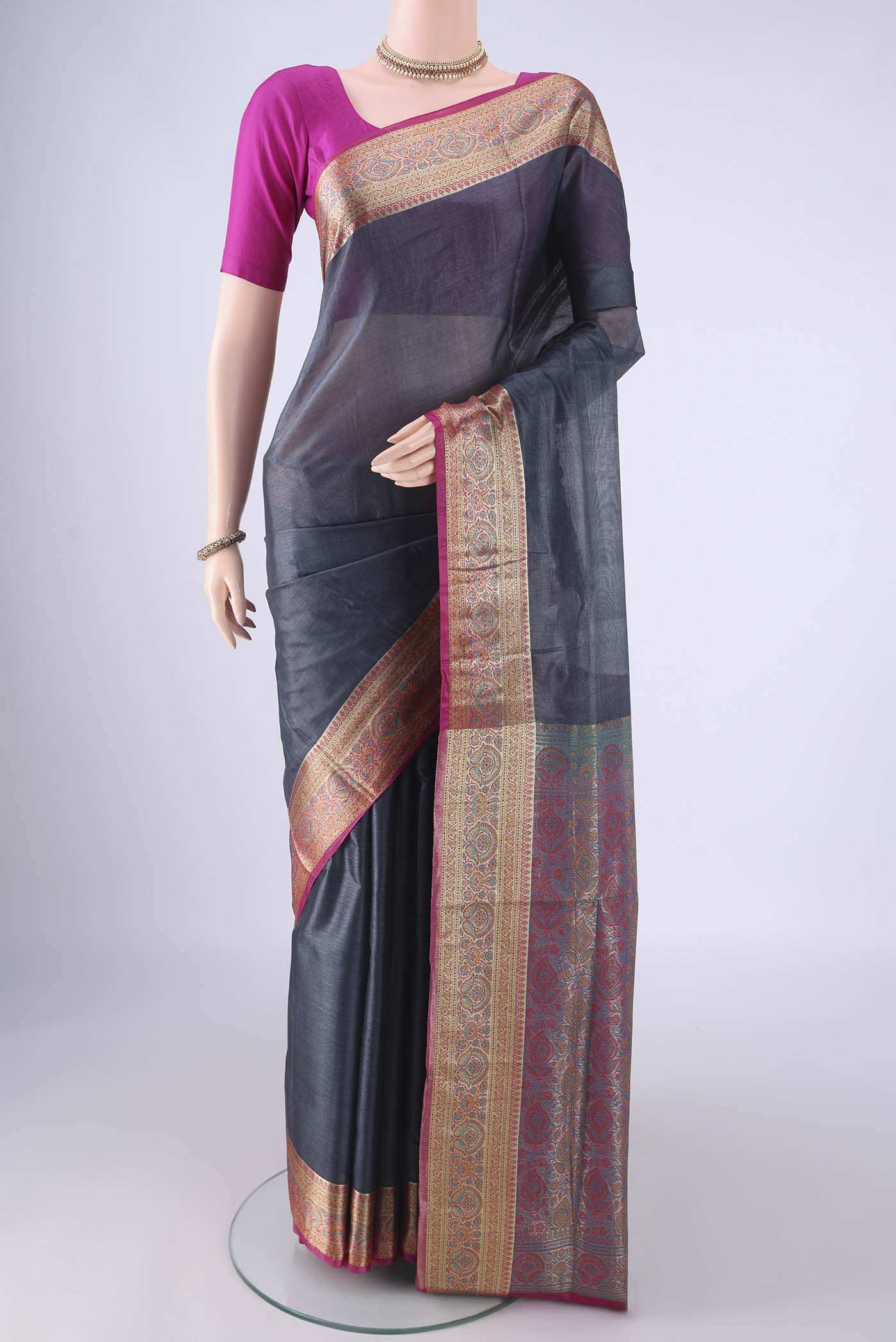 Grey Banarasi Tussar Silk Saree with Plain Body and Zari Border.  displayed on a mannequin