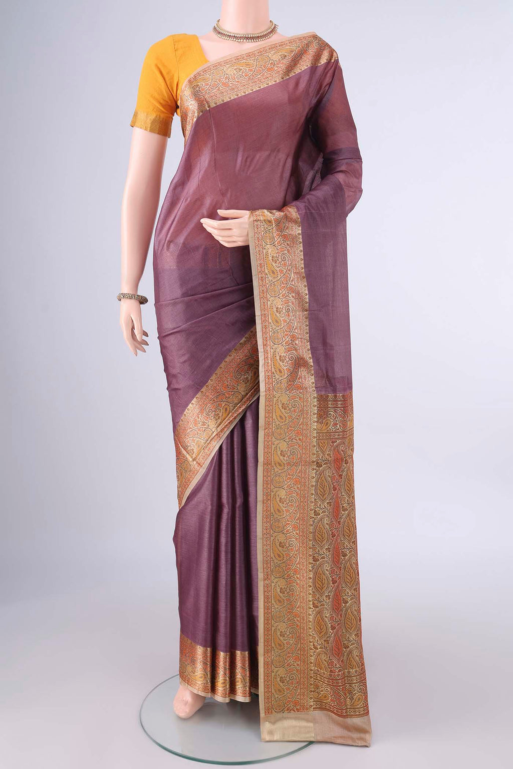 Brown Banarasi Tussar Saree with Plain Body and Zari Border.  displayed on a mannequin
