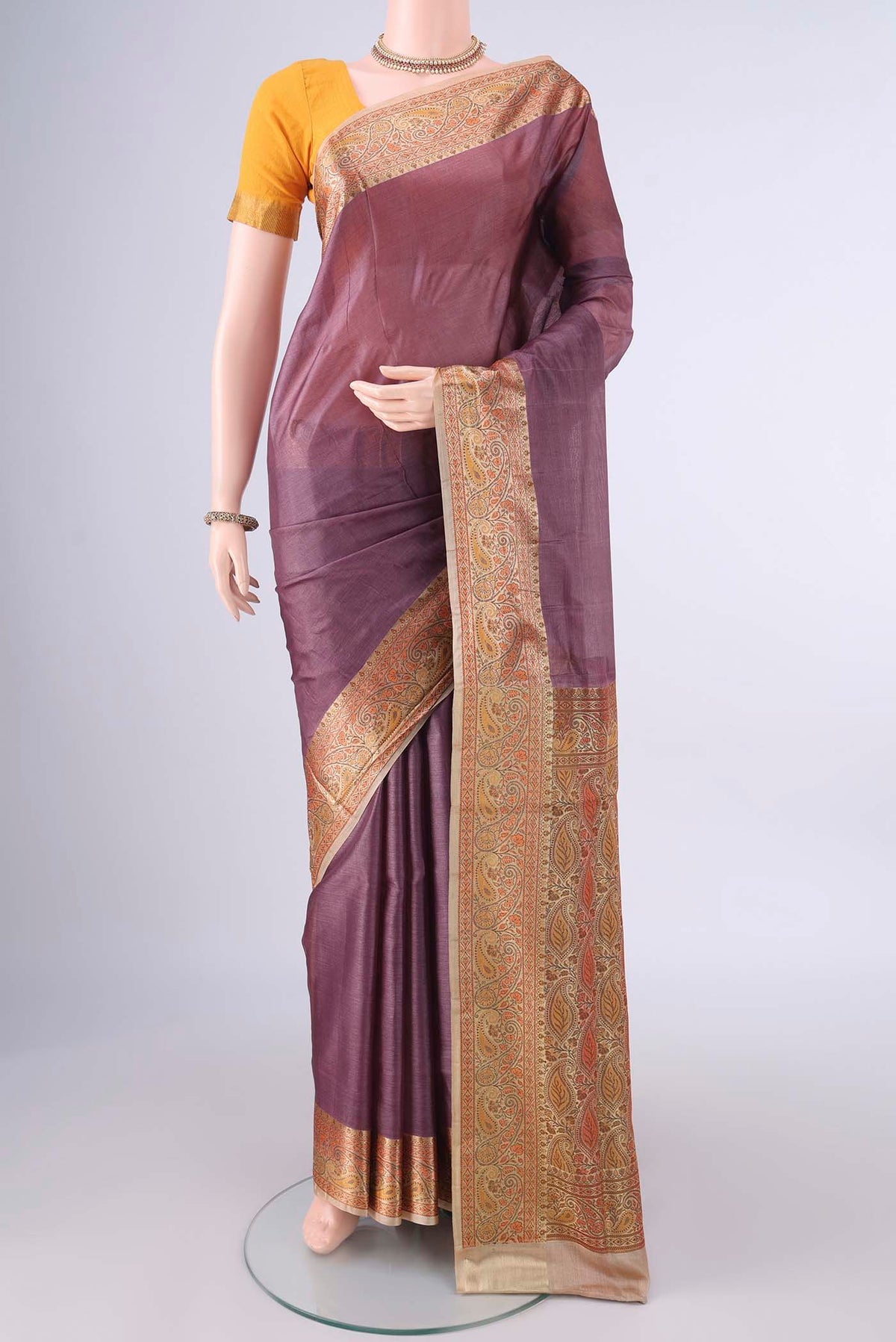 Brown Banarasi Tussar Saree with Plain Body and Zari Border.  displayed on a mannequin