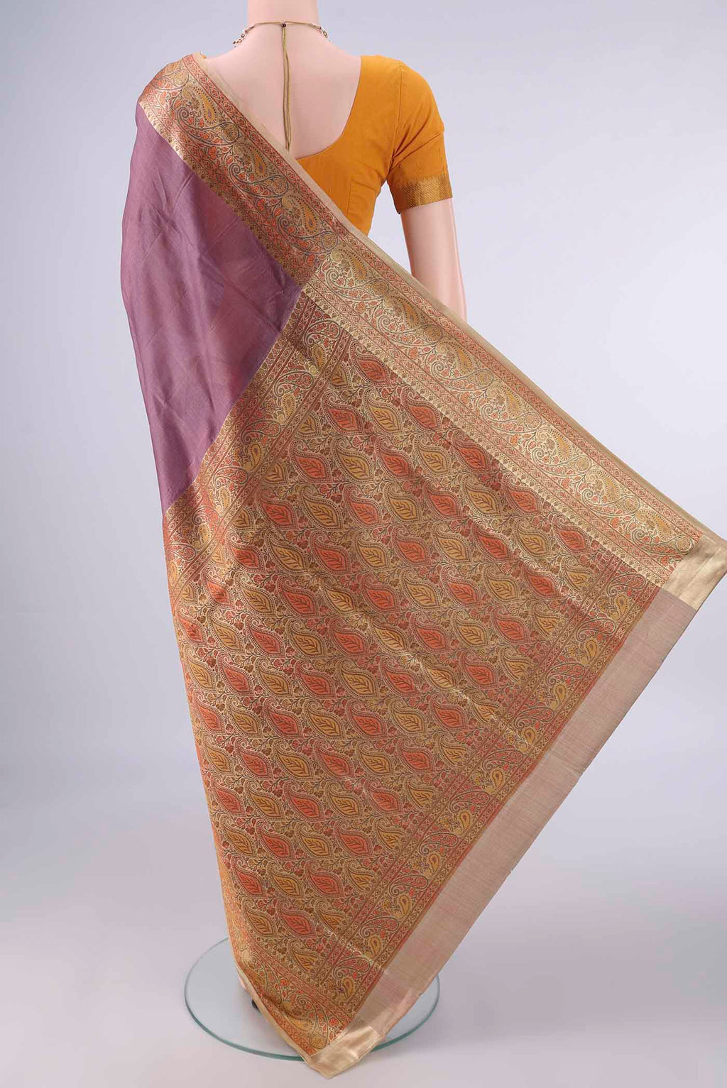Flat view of Brown Banarasi Tussar Saree with Plain Body and Zari Border. 