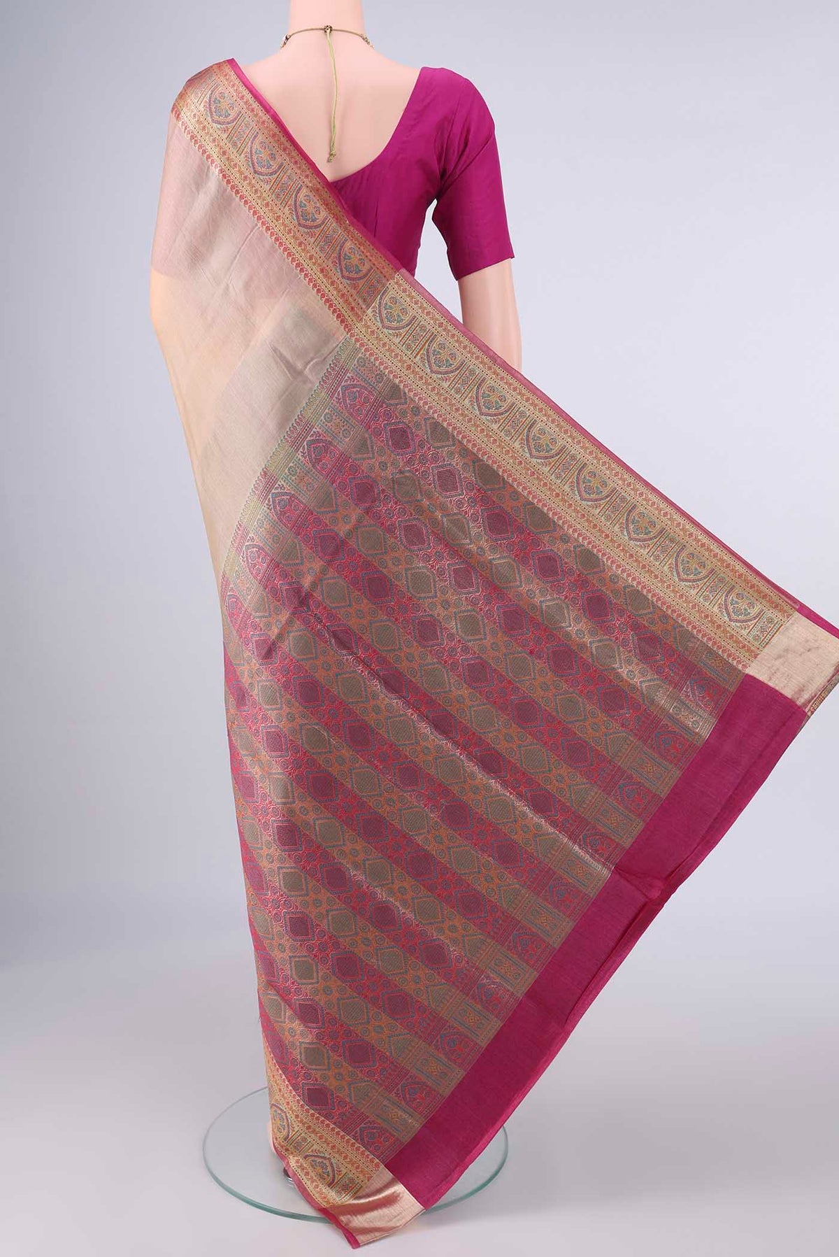 Flat view of Beige Banarasi Tussar Saree with Plain Body and Zari Border. 