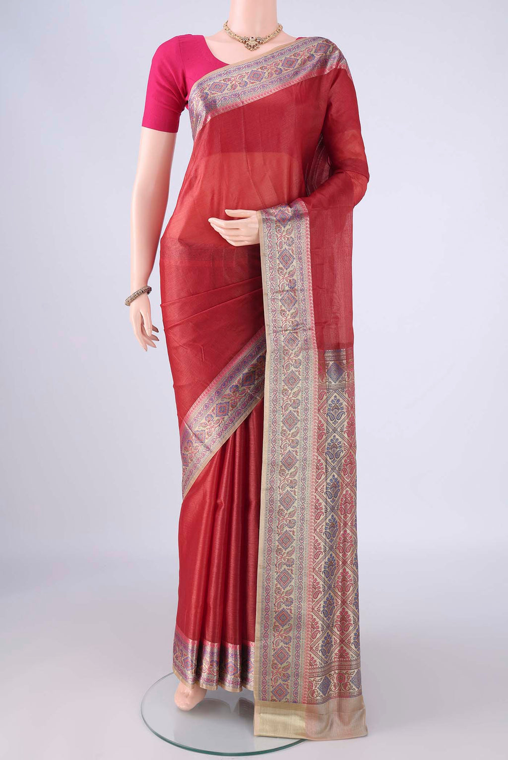 Imperial Red Banarasi Tussar Silk Saree with Plain Body and Zari Border.  displayed on a mannequin