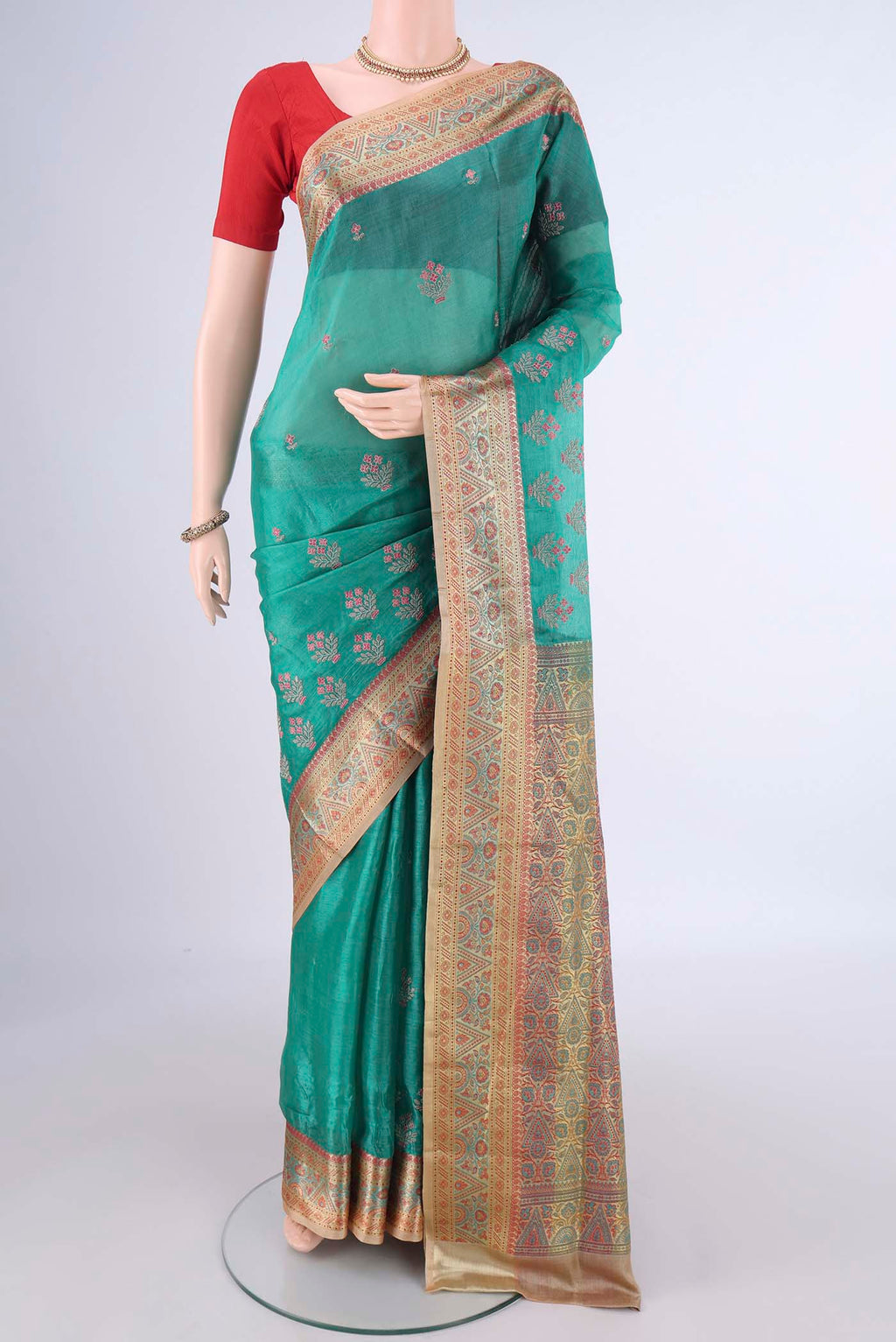 Sea Green Banarasi Tussar Silk Saree with Embroidery on the body and Zari Border.  displayed on a mannequin