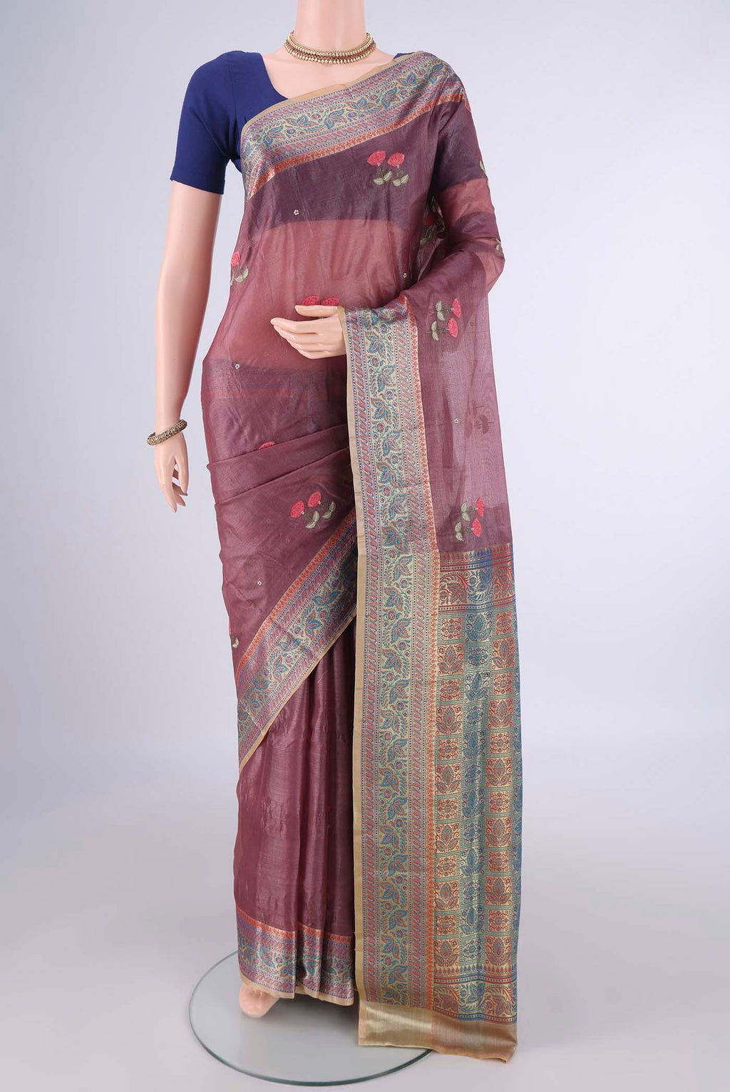 Dark Mauve Banarasi Tussar Silk Saree with Embroidery on the body and Zari Border.  displayed on a mannequin