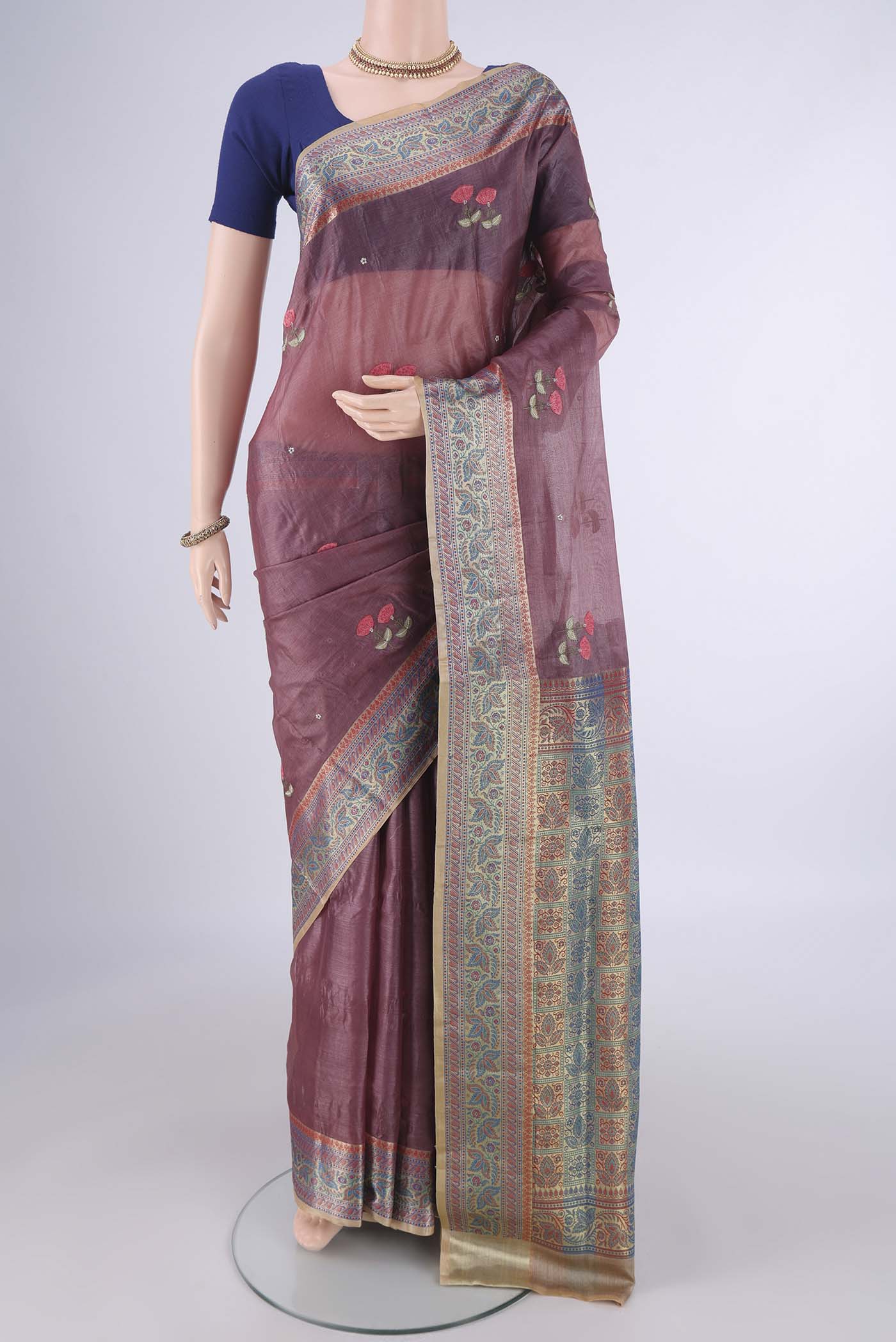 Dark Mauve Banarasi Tussar Silk Saree with Embroidery on the body and Zari Border.  displayed on a mannequin