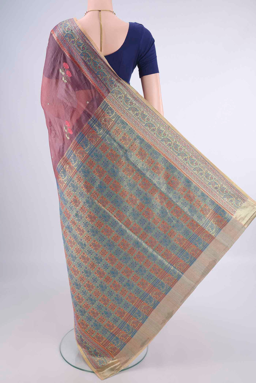Flat view of Dark Mauve Banarasi Tussar Silk Saree with Embroidery on the body and Zari Border. 